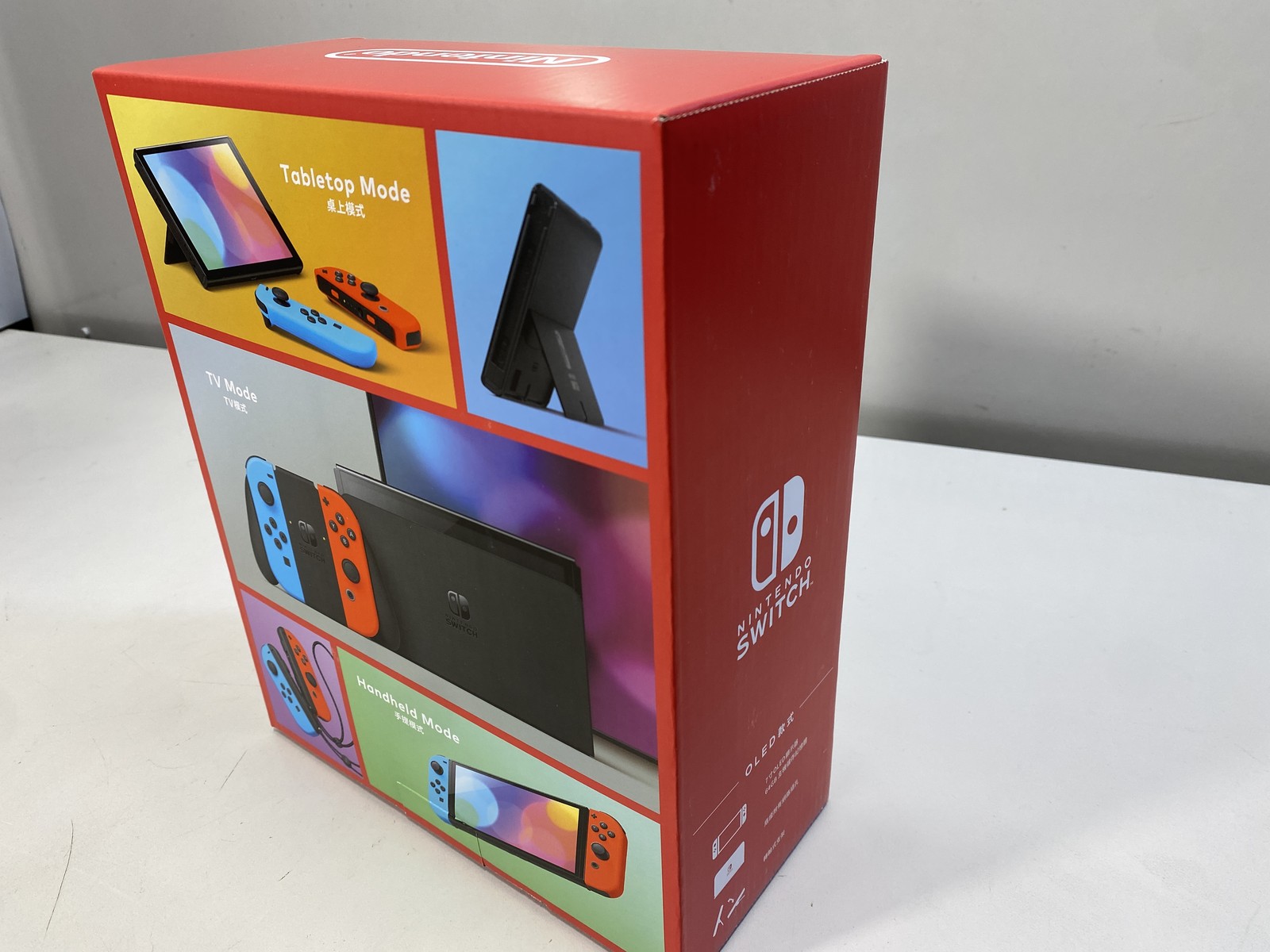 Nintendo Switch OLED Handheld Console With Red/Blue Joy-Con – 64GB