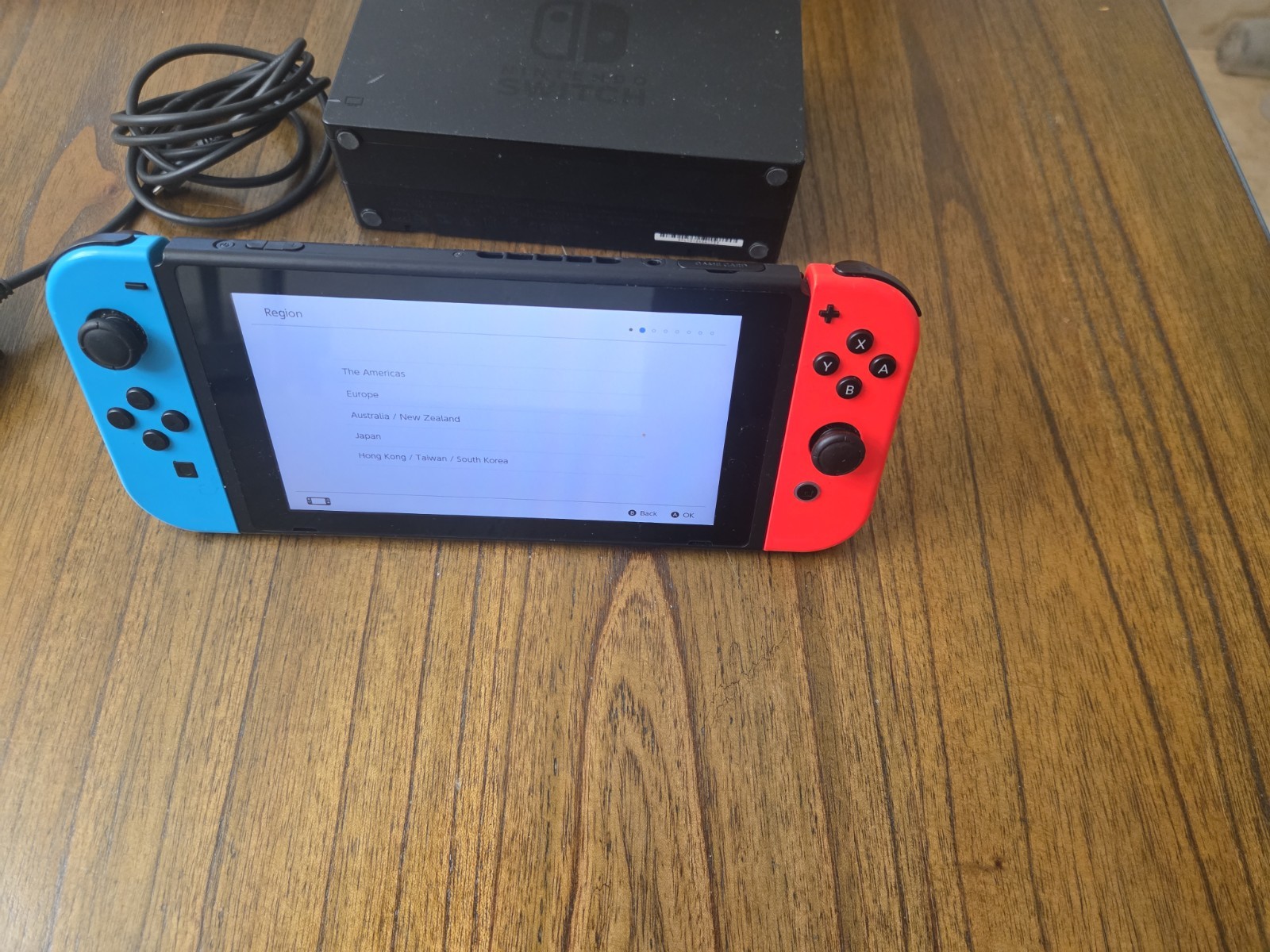 Nintendo Switch Console with Neon Red and Blue Joy-Cons, Plus Games