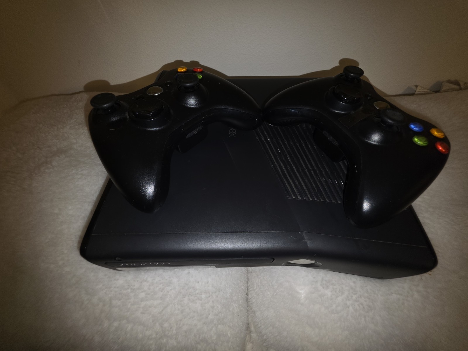 Microsoft Xbox 360 Slim console bundle with two controllers