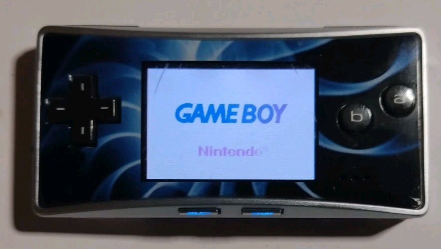 Nintendo Game Boy Micro GBA (Working) with Cracked Faceplate & 3rd-Party Charger