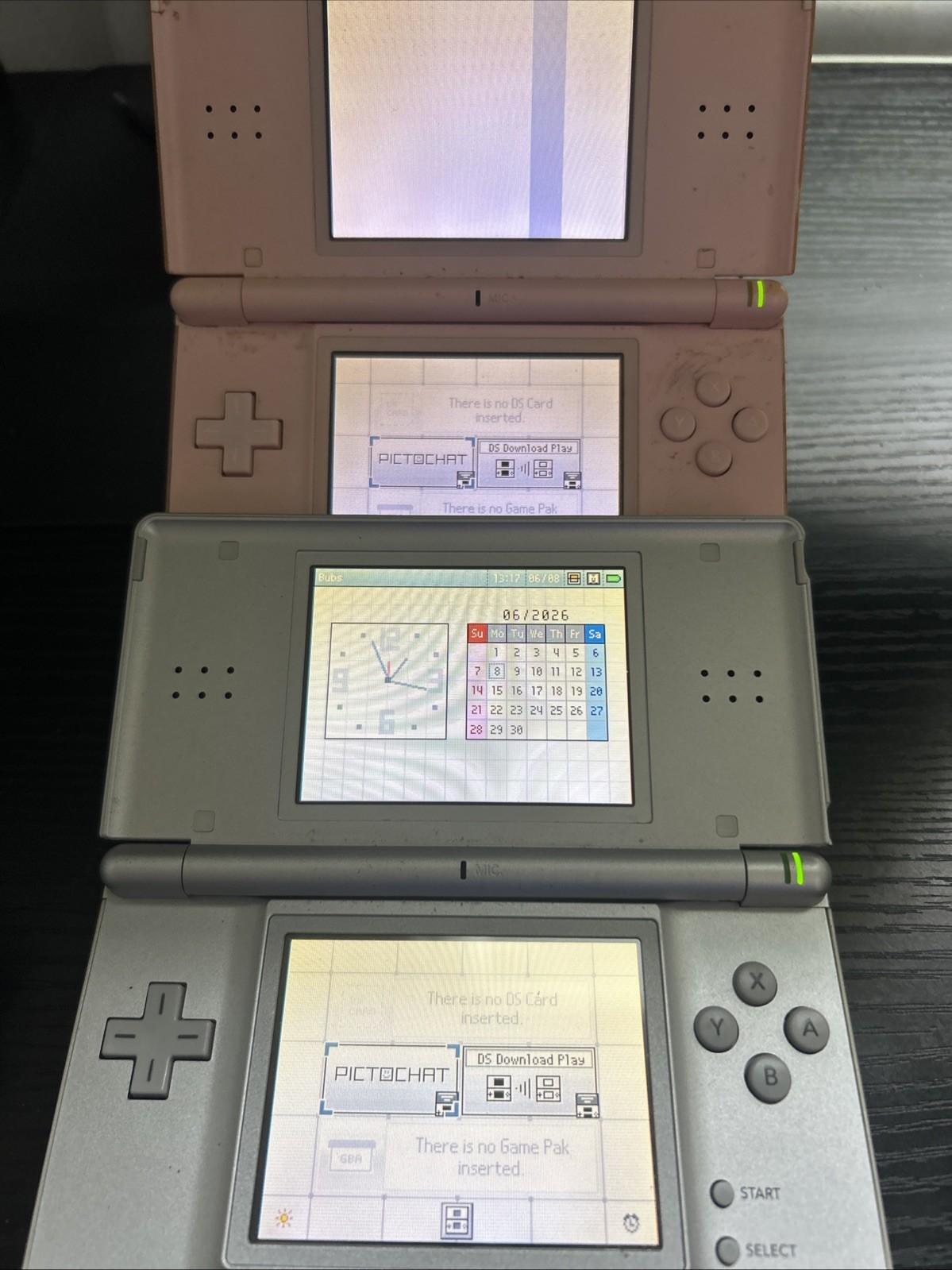 Nintendo Ds Lite Handheld Bundle 2 consoles, charger and stand. *all flaws shown