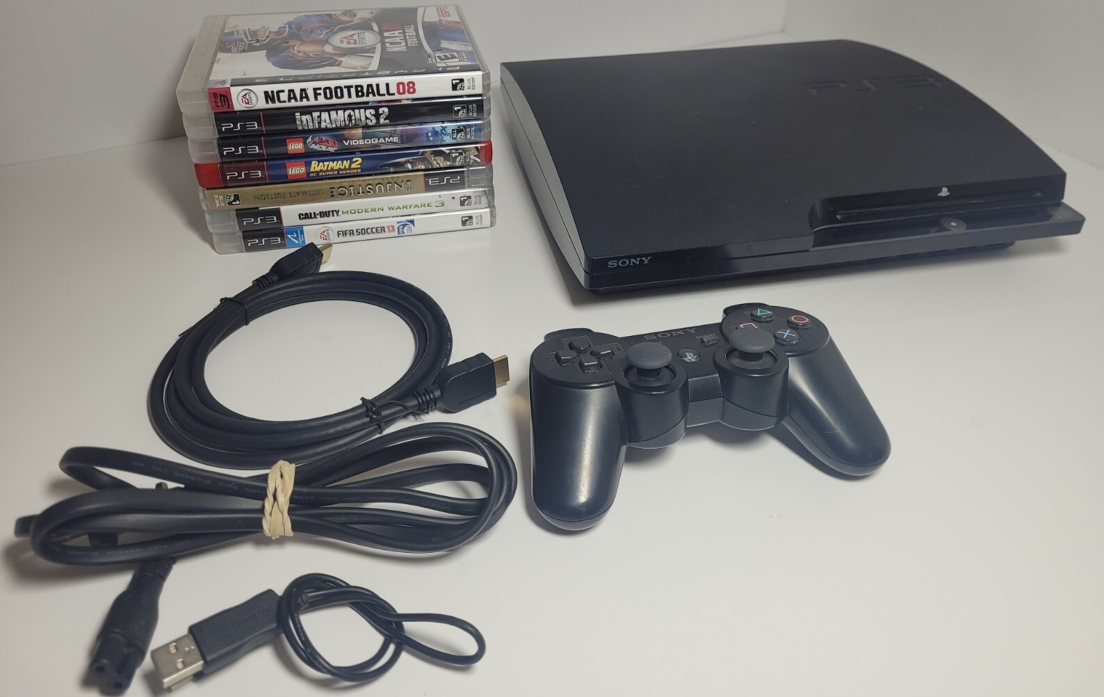 Sony PlayStation 3 Slim 160GB CECH-2001B PS3 Console Bundle – 7 Games Bundle