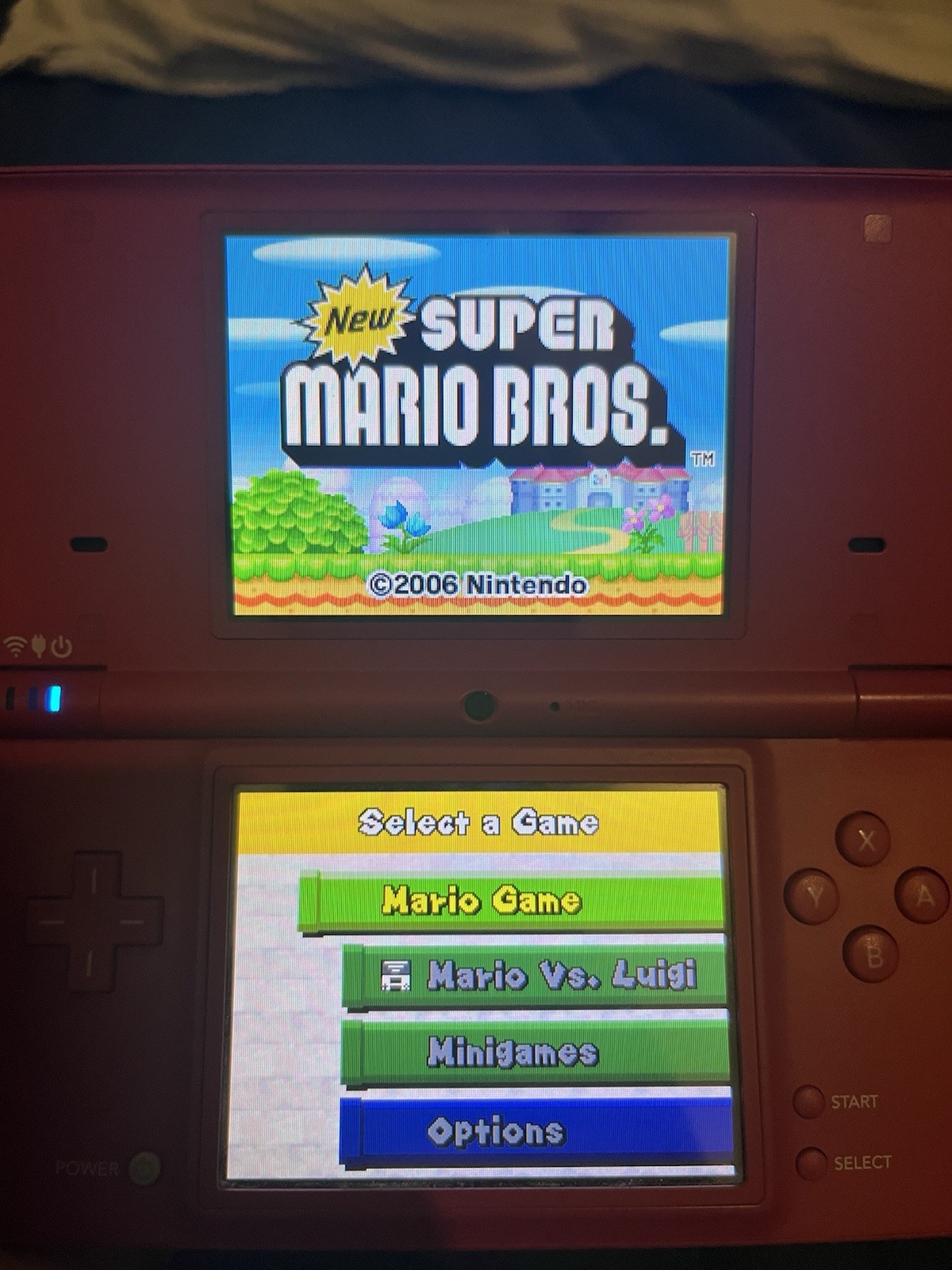 Nintendo DSi Red Handheld Console w/ Stylus, Charger & 5 Games Wi-Fi Touchscreen