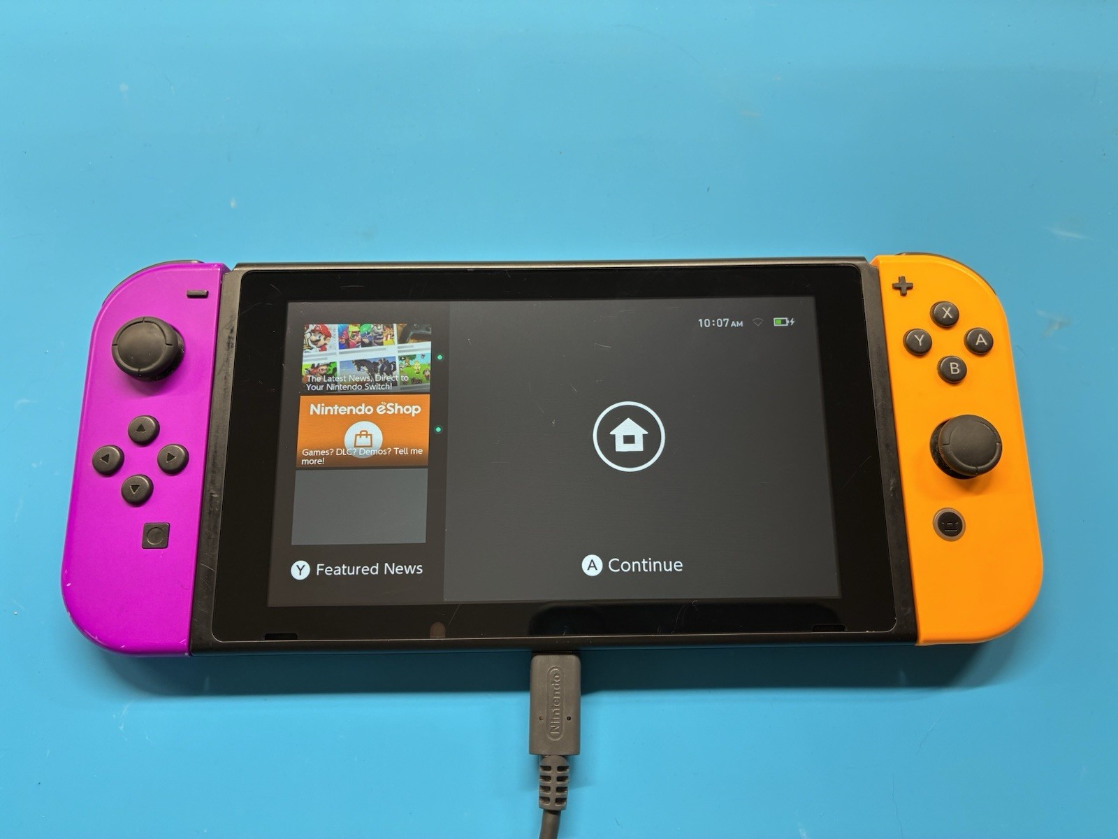 Nintendo Switch v2 with Purple and Orange JoyCons – TESTED & WORKING