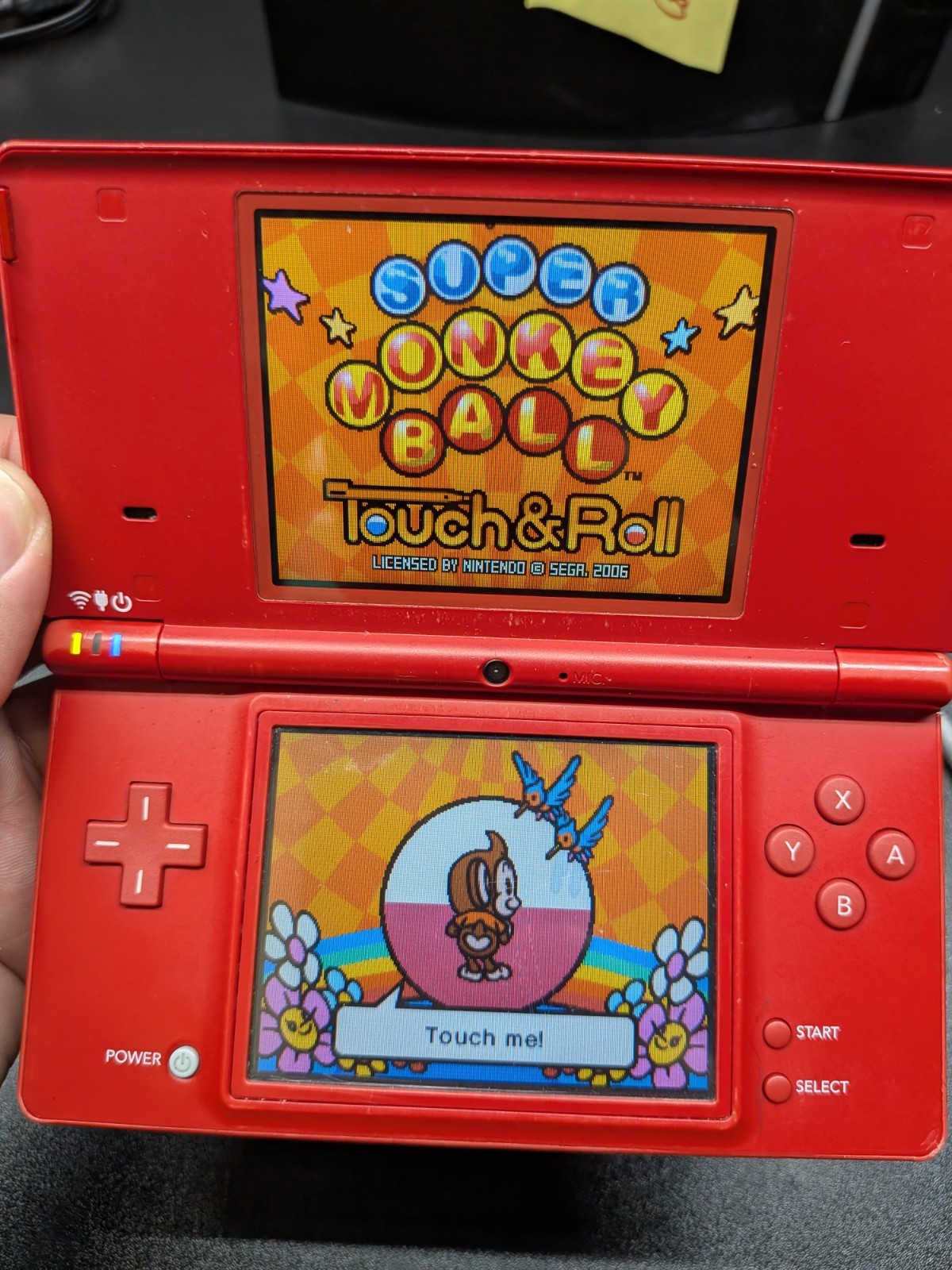 Red Nintendo DSi Console w/ Charger, Stylus and Super Monkey Ball Game (TWL-001)