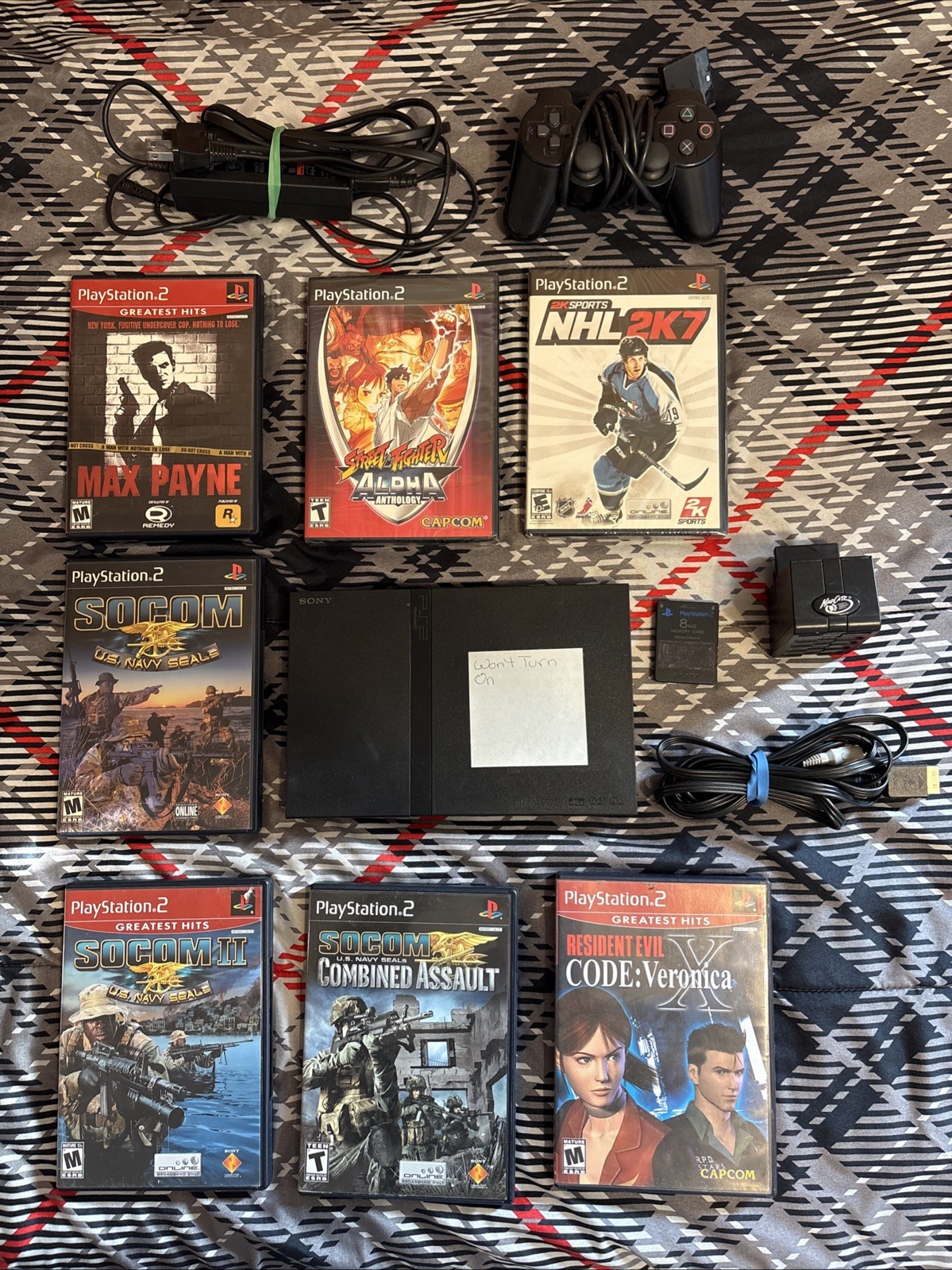 Sony PS2 Console, Controller, 4 Player Adaptor, Wires, 8mb Memory Card,& 7 Games
