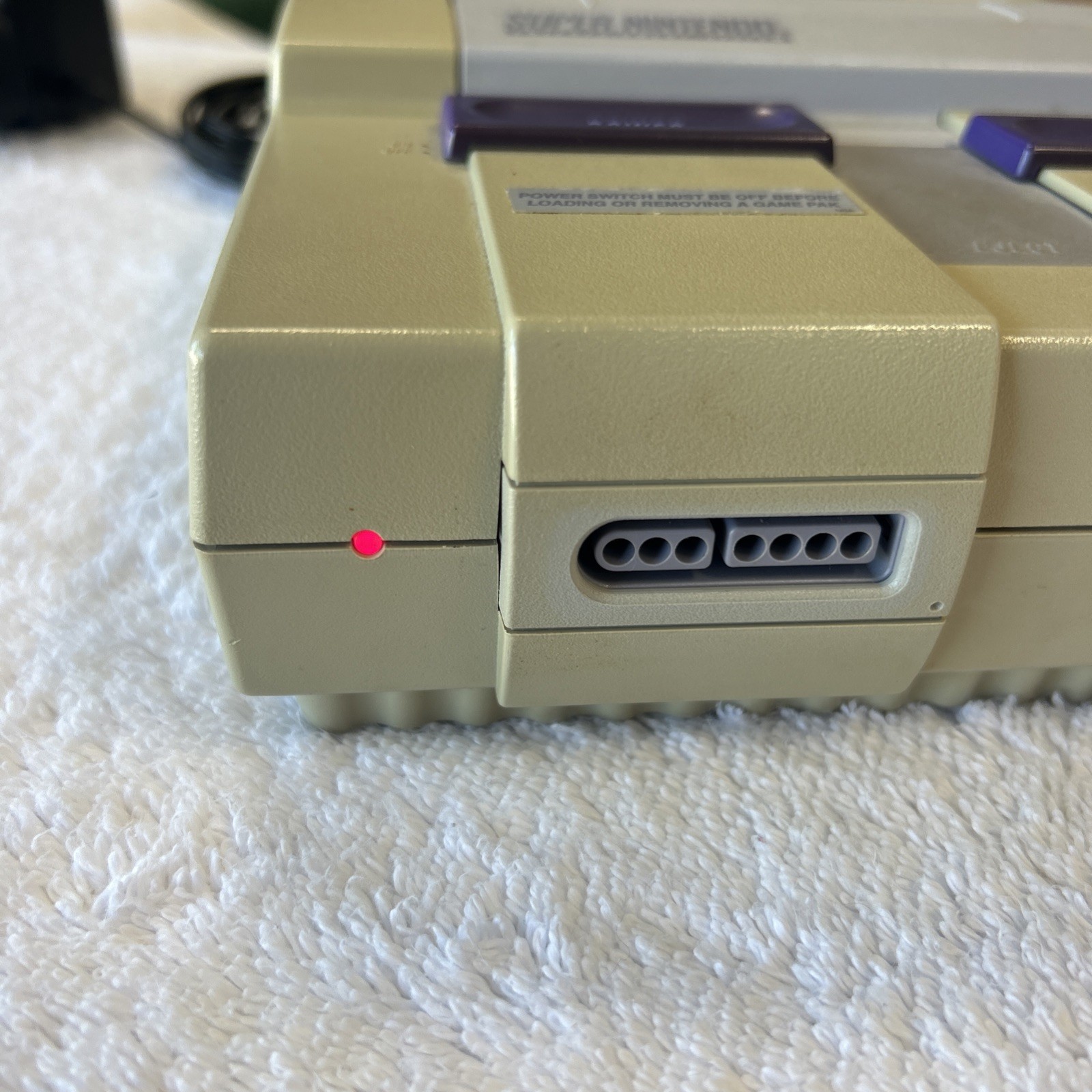 Super Nintendo console only. Includes RF Switch And Power Supply.