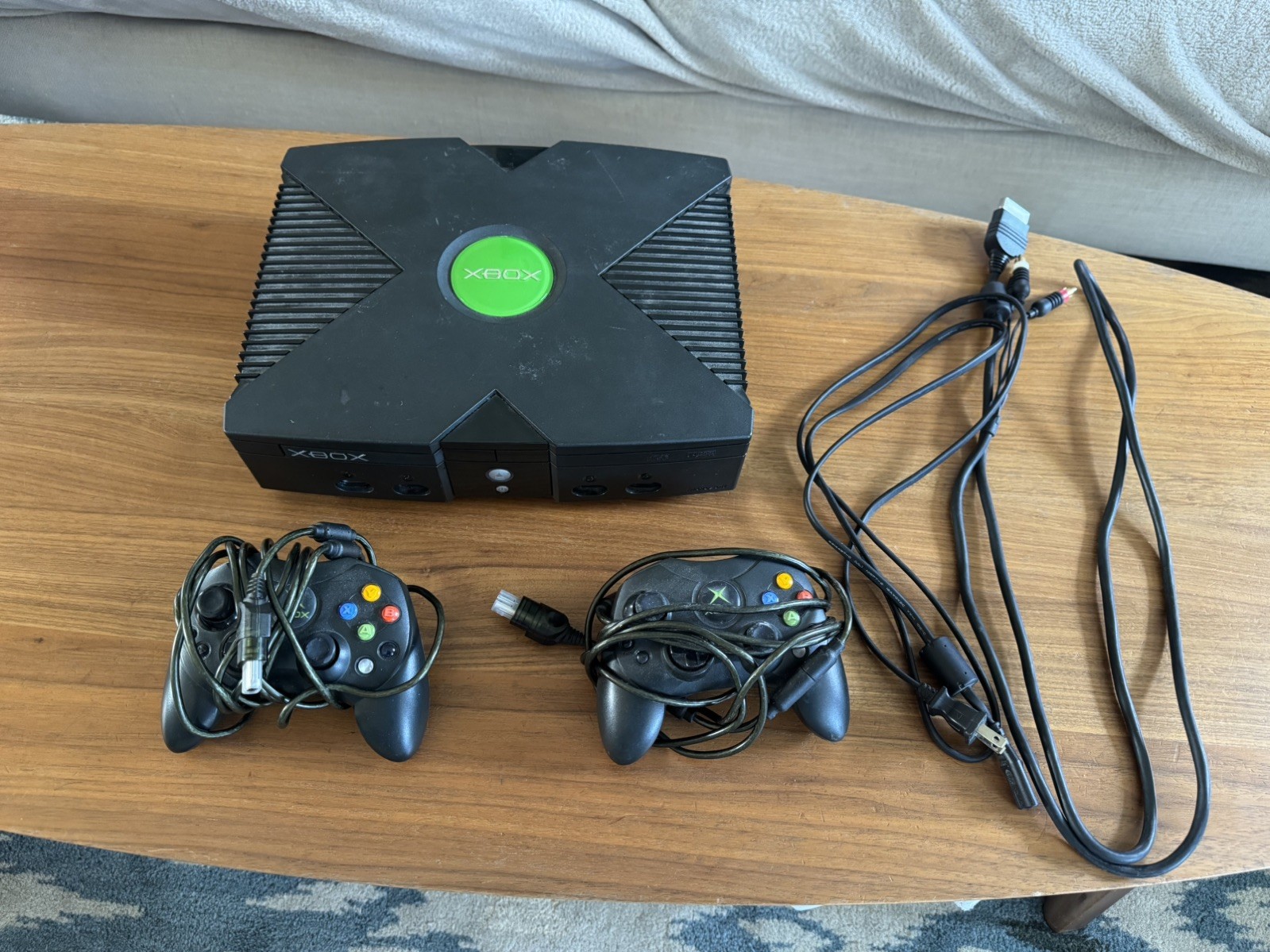 black xbox original consol works connects to tv controllers works fine and cords