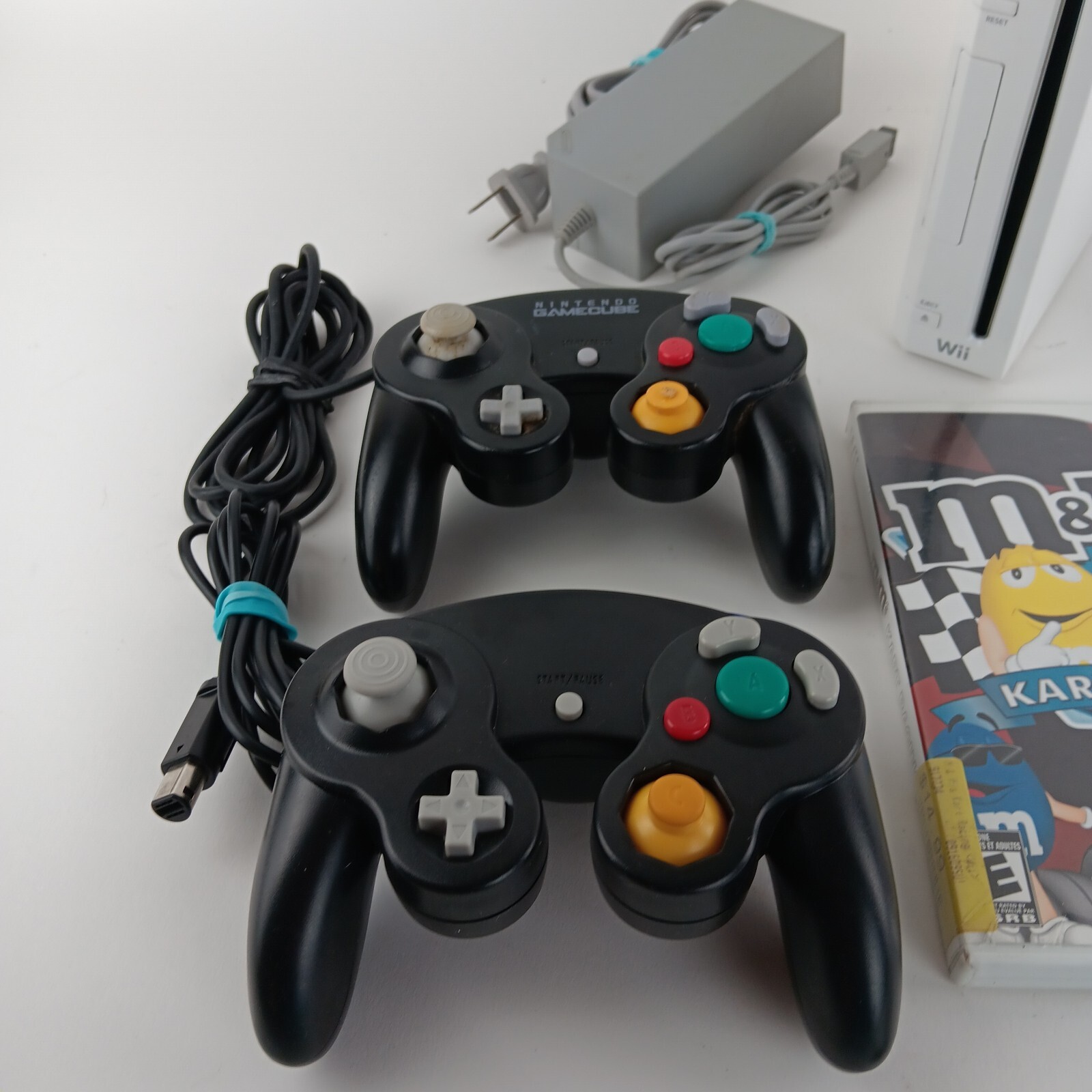 Wii Bundle 2 Game Cube Controlers, M&M Cart Racing. Worn Pad On 1 Right Toggle,