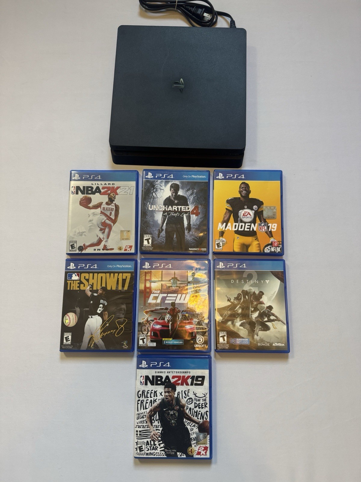 Sony PlayStation 4 Slim Gaming Console with 7 Games