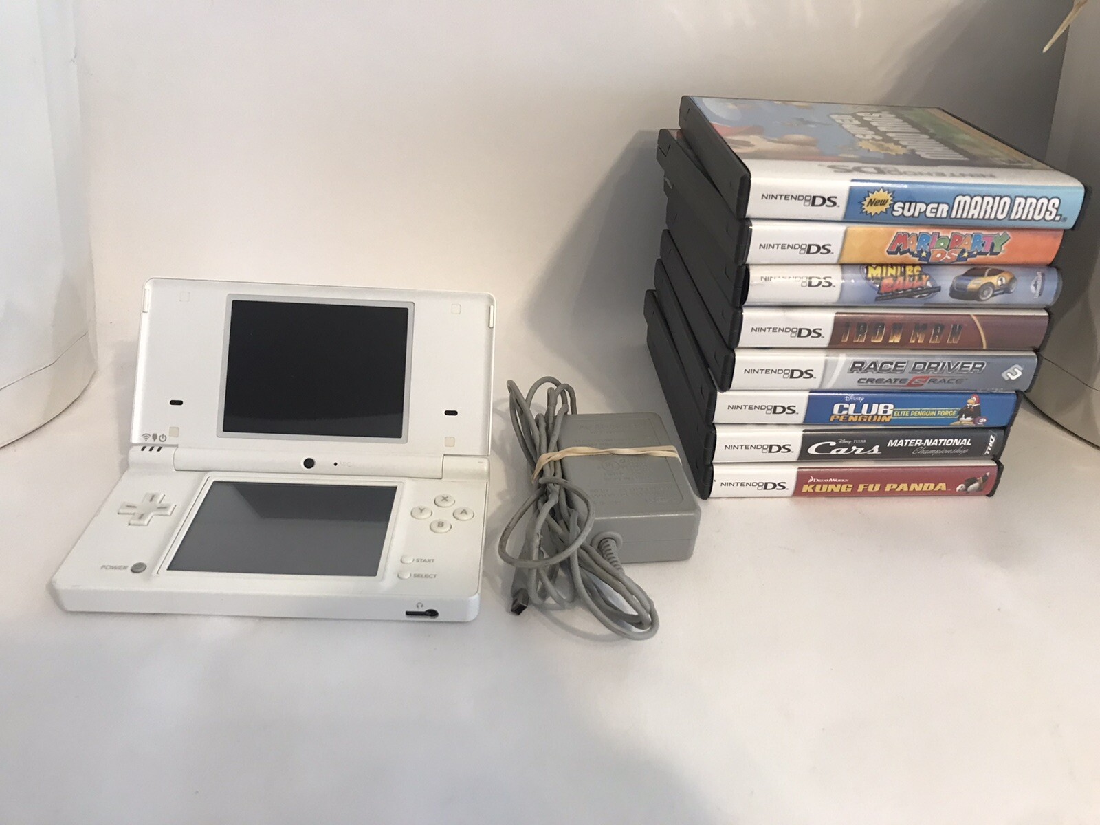 Nintendo DSi Handheld Game Console – White- with charger and 8 games