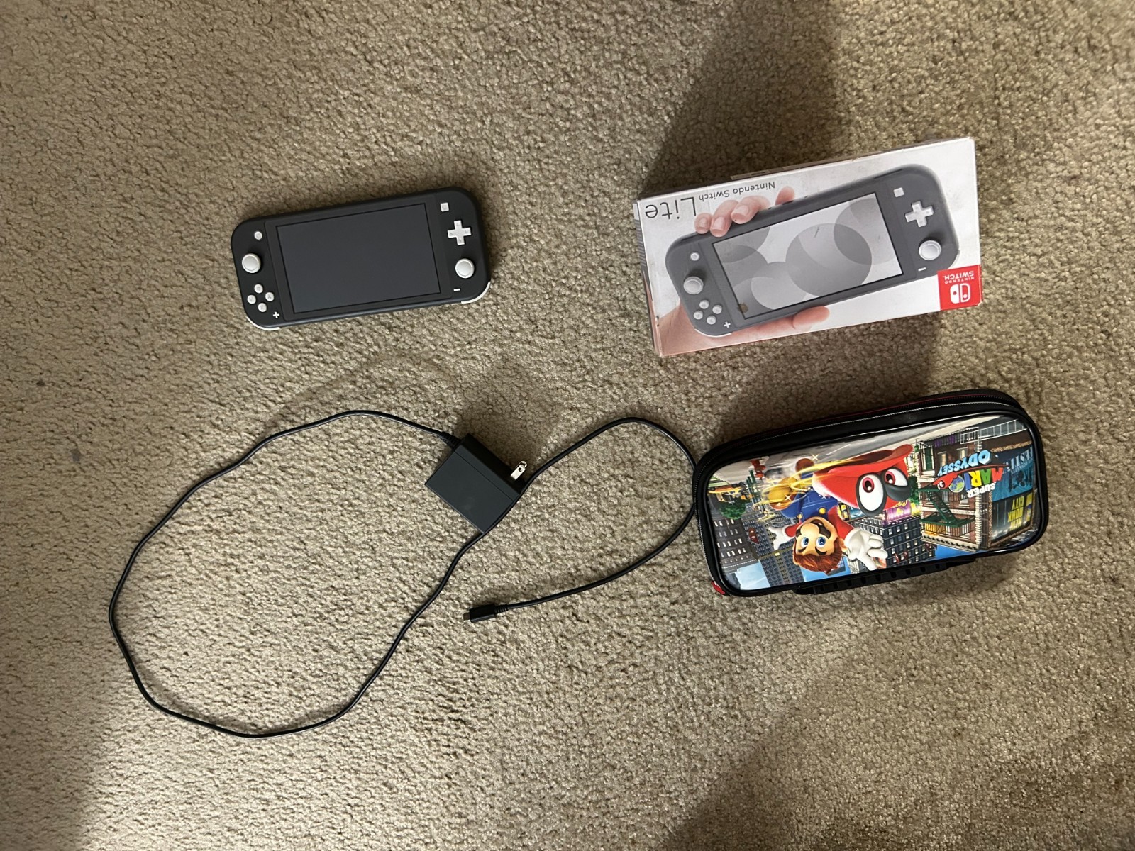 Nintendo Switch Lite Gray Handheld System with Mario odyssey carrying case