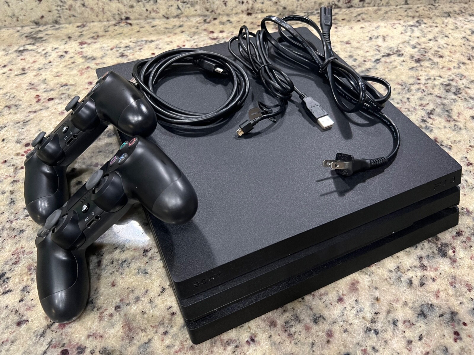 PS4 PRO 1TB + 2 ps4 standard controllers(power and HDMI cables included)
