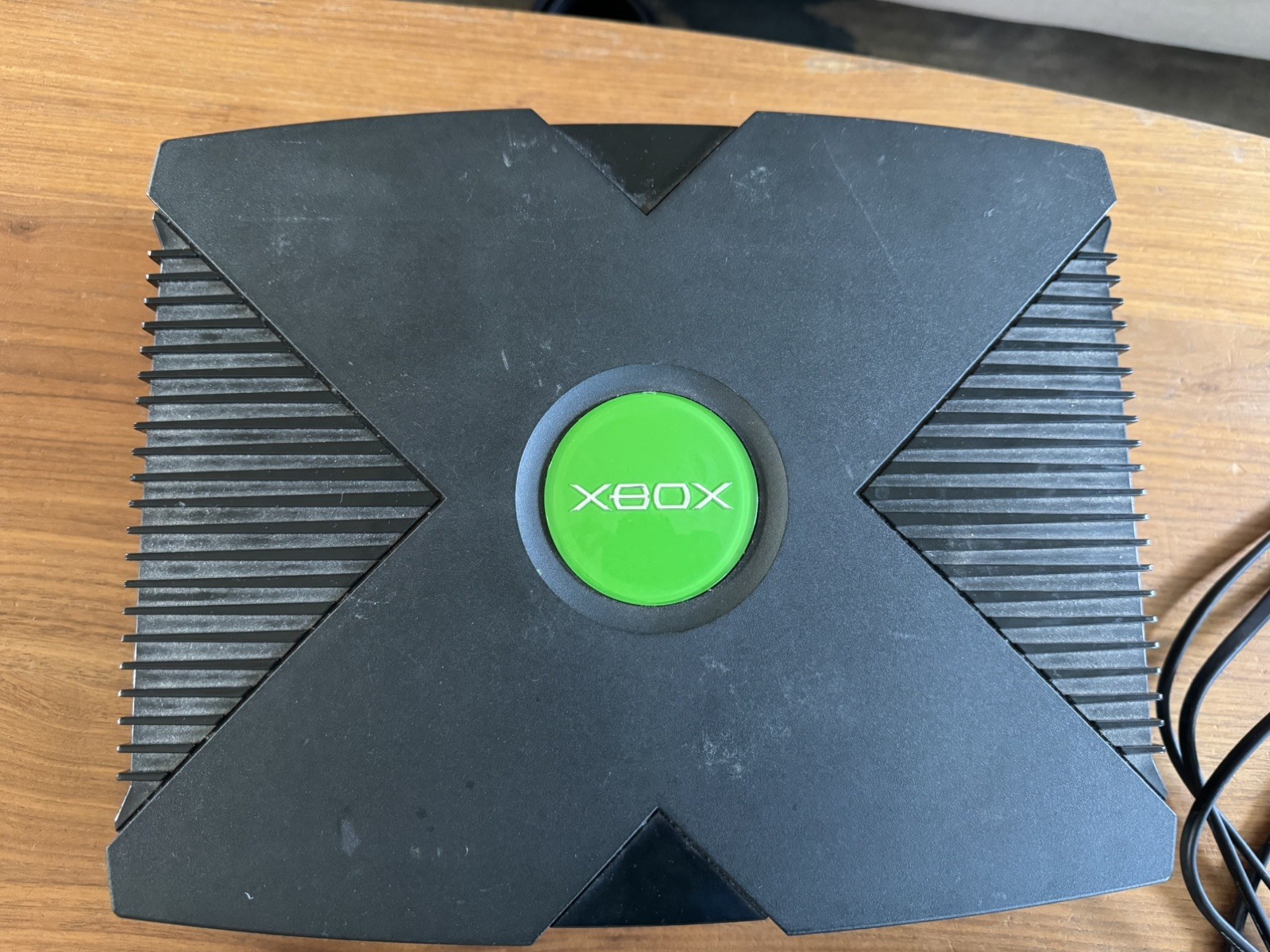 black xbox original consol works connects to tv controllers works fine and cords