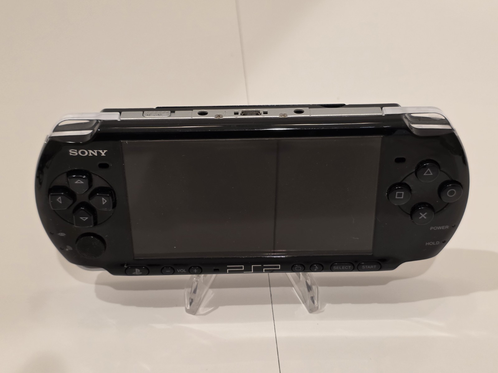 Sony PSP 3001 Black Handheld Console with Charger, Car Adapter, and 5 Games.