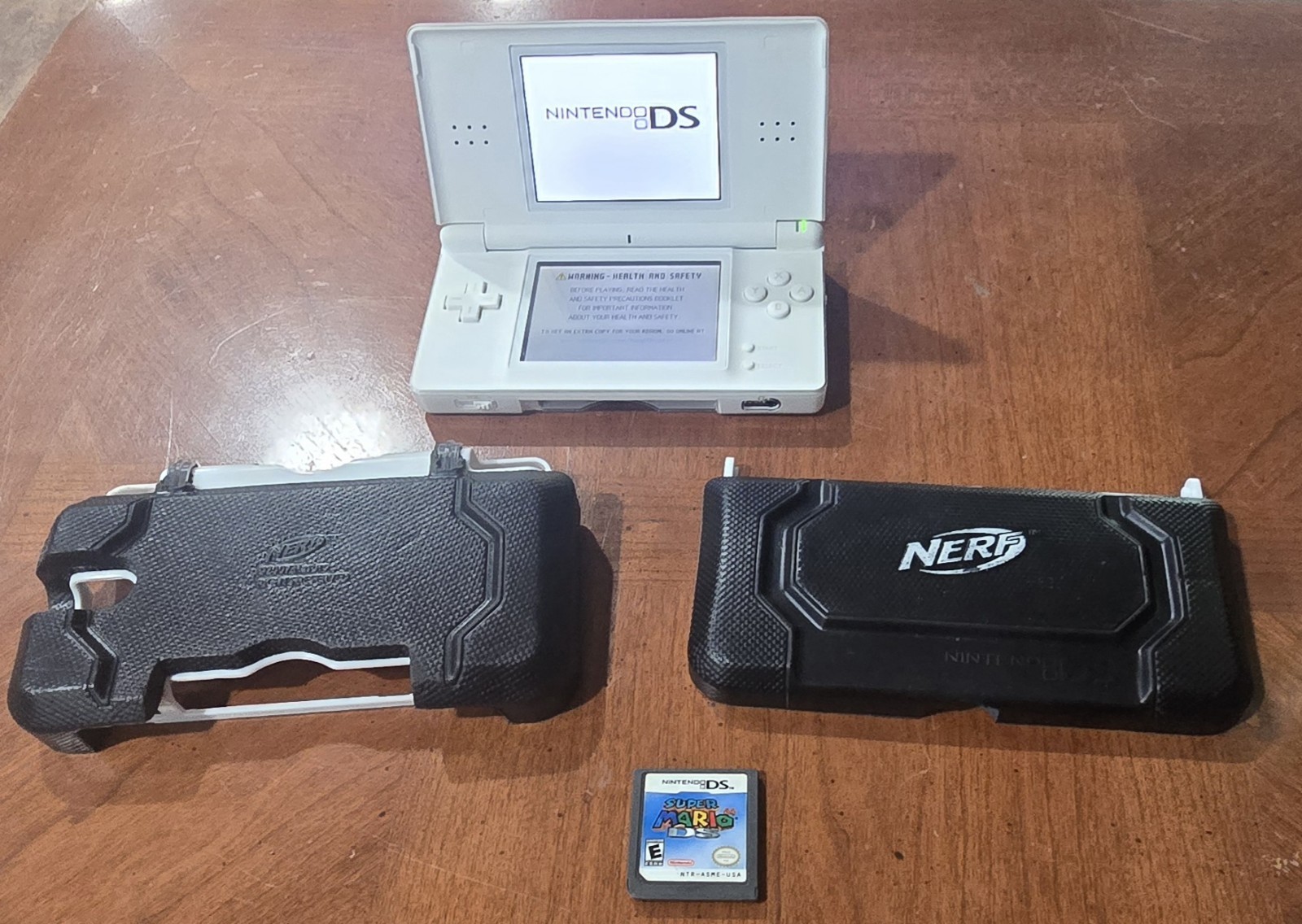 Nintendo DS Lite Polar White Handheld Gaming System with Nerf Case & Mario game!