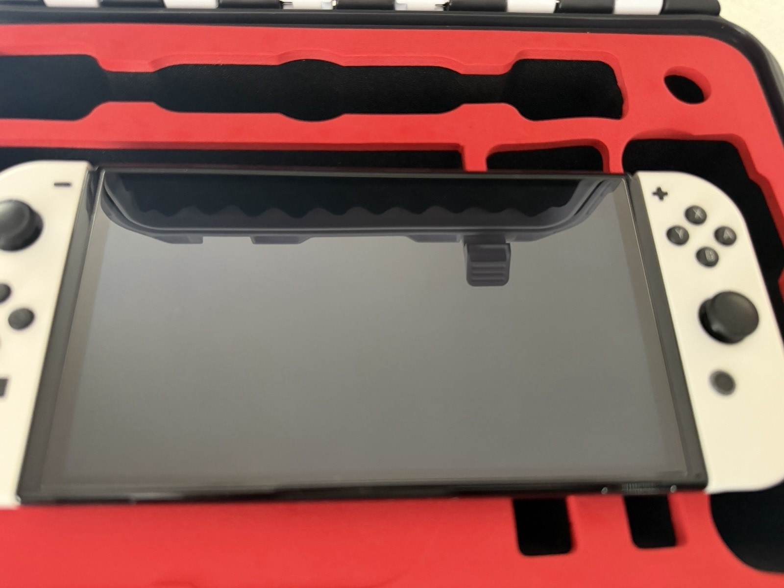 Bundle – Nintendo Switch OLED 64GB White Joy-Con w/ Extra Grip and Hard Case