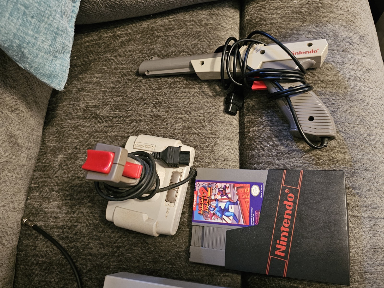 Original NES Console With Controllers, Hookups, Guns, Joysticks And Mega Man 2