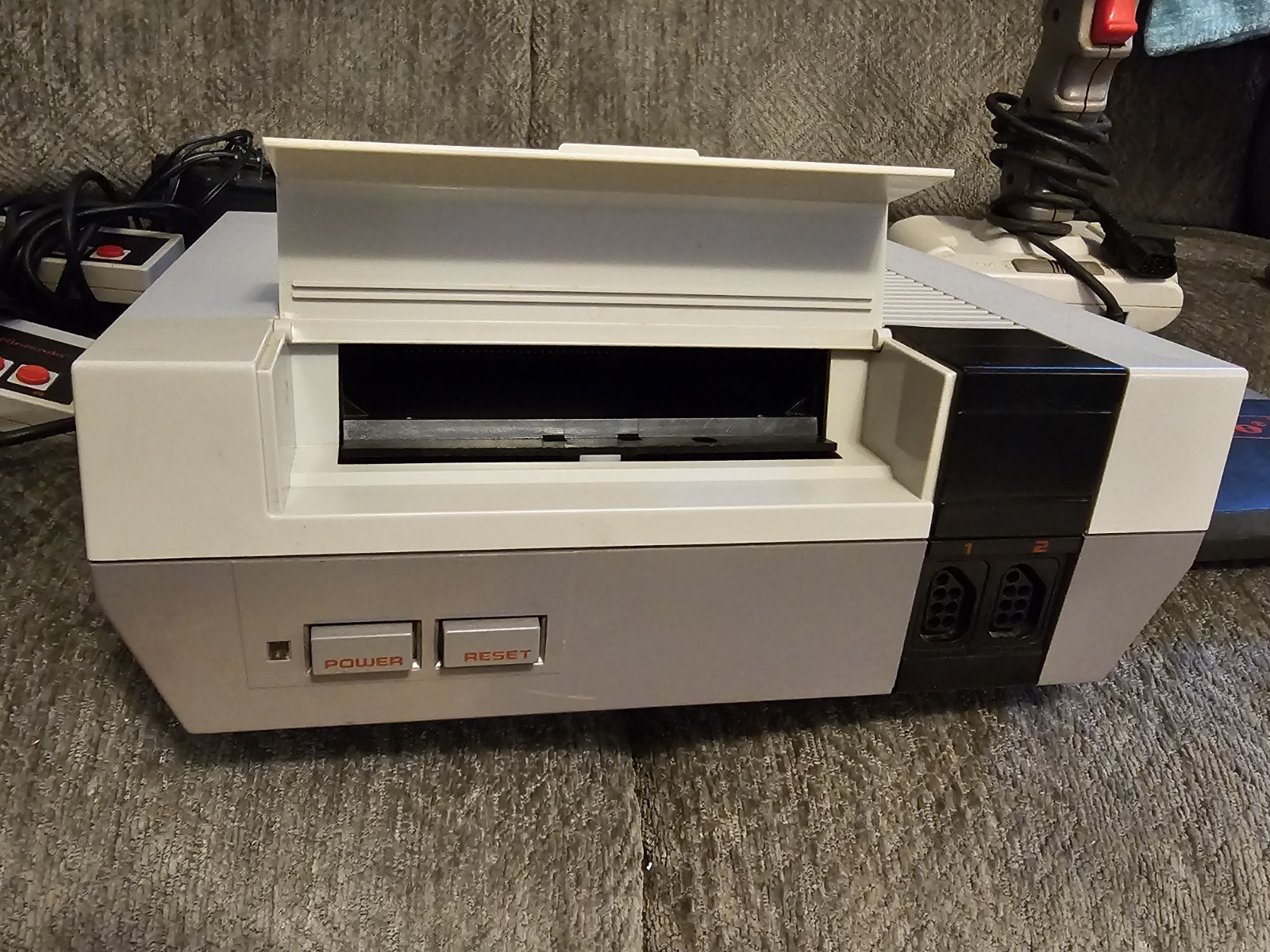 Original NES Console With Controllers, Hookups, Guns, Joysticks And Mega Man 2