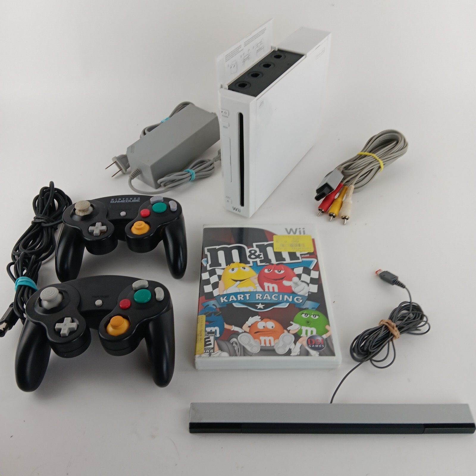 Wii Bundle 2 Game Cube Controlers, M&M Cart Racing. Worn Pad On 1 Right Toggle,