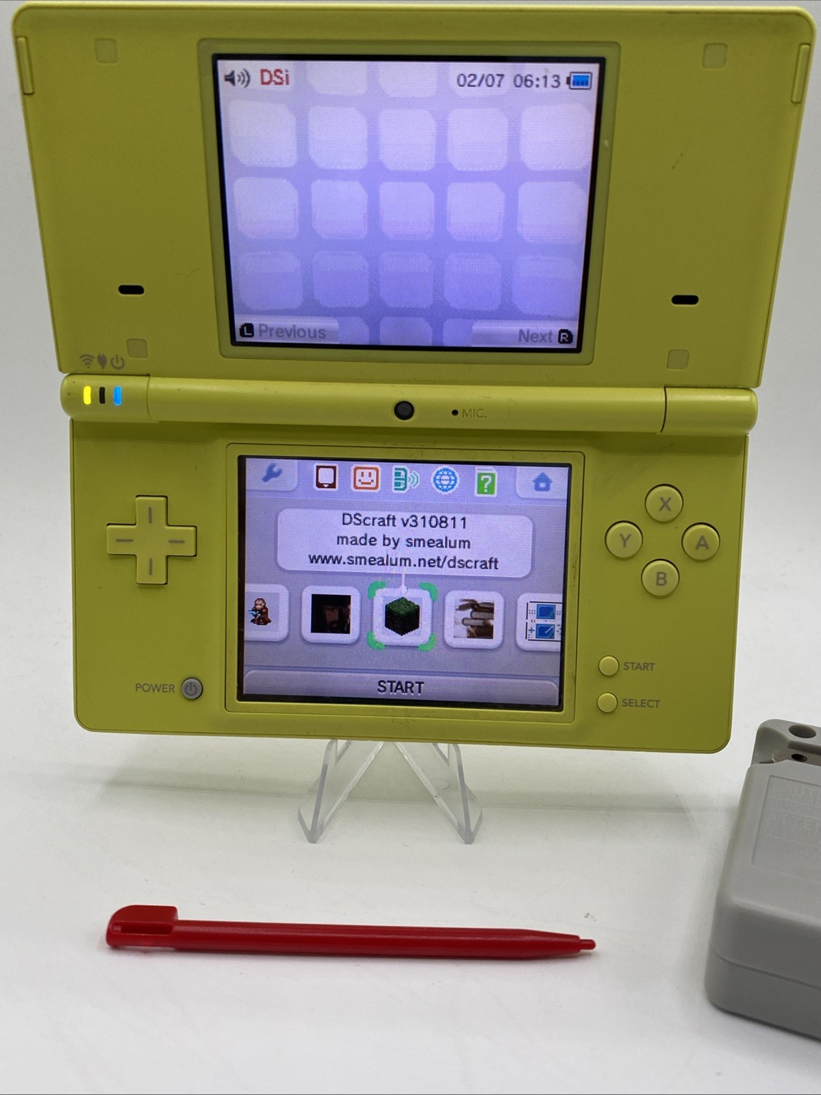 Nintendo DSi Yellow – Includes Preloaded Library (Large Collection)