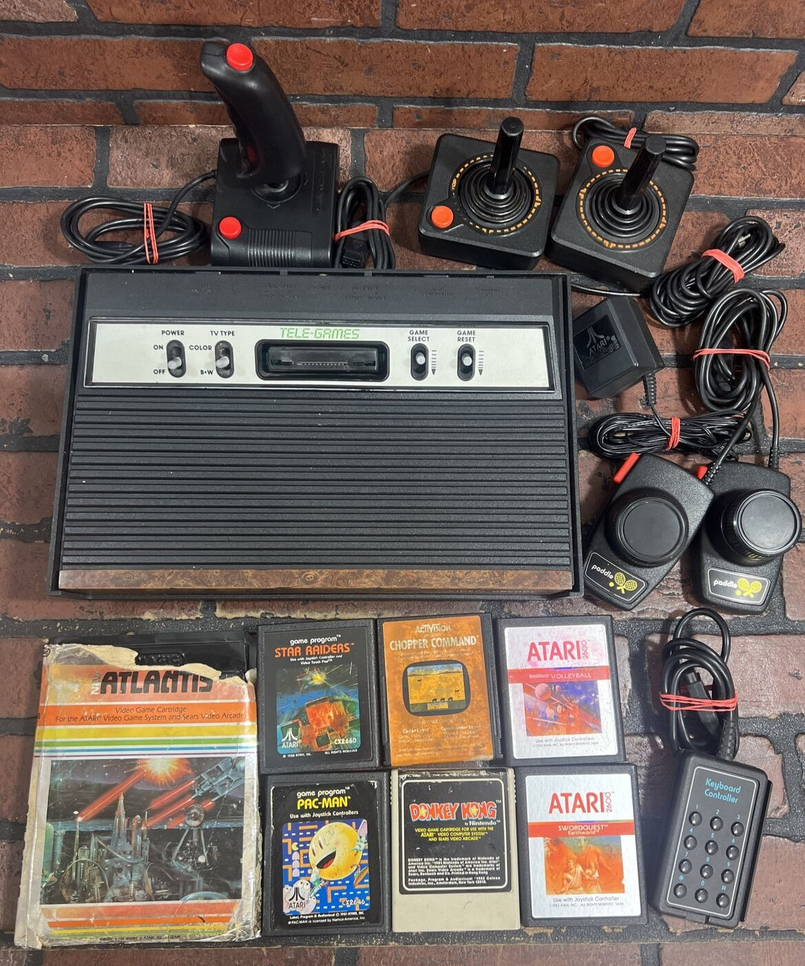 ATARI 2600 4-Switch w/ Power Supply, Joysticks, Paddles, TV Adapter & 7 Games