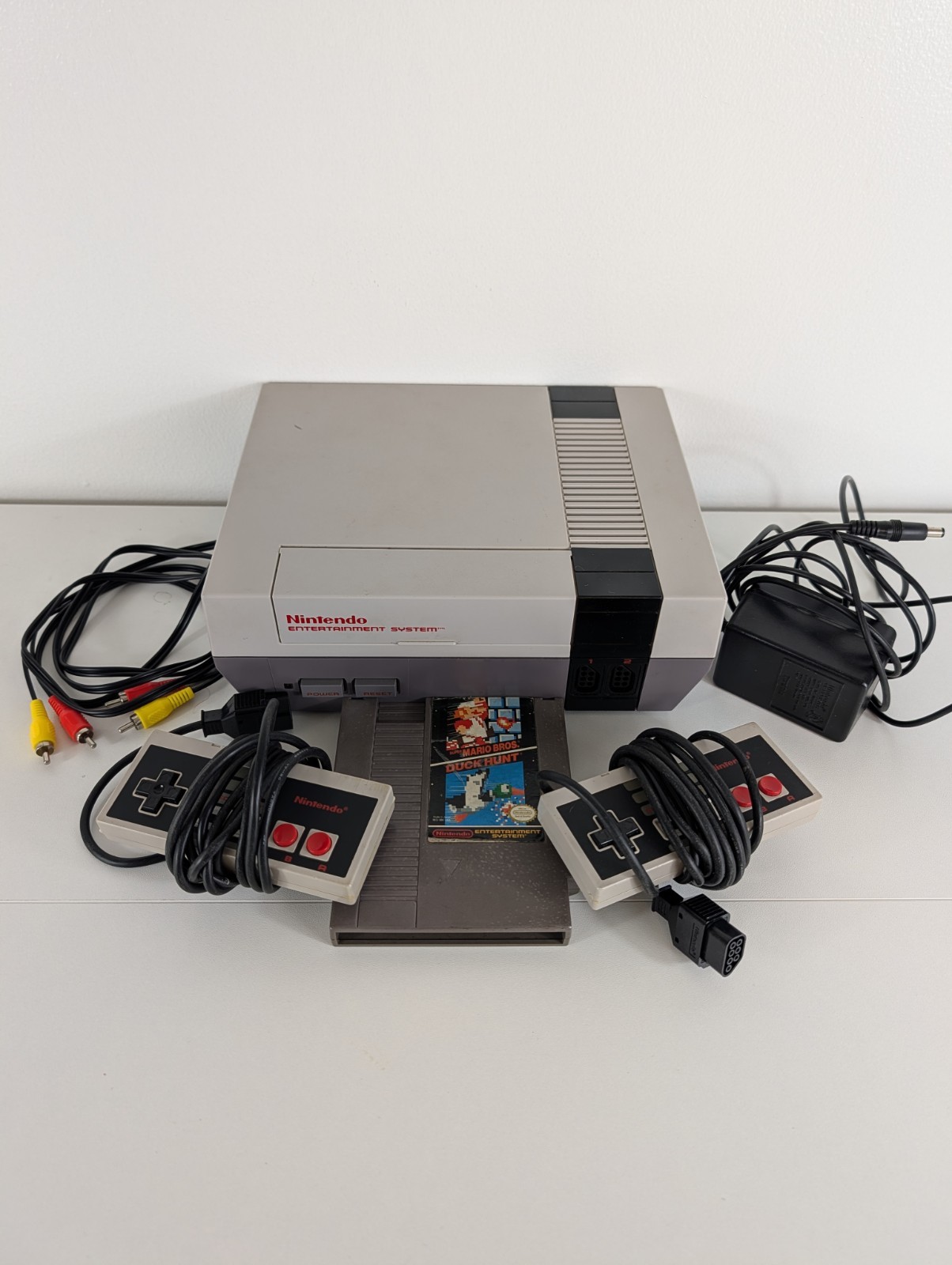 Nintendo NES Console Bundle – w/Cables, 2 OEM controllers, Game – TESTED WORKING