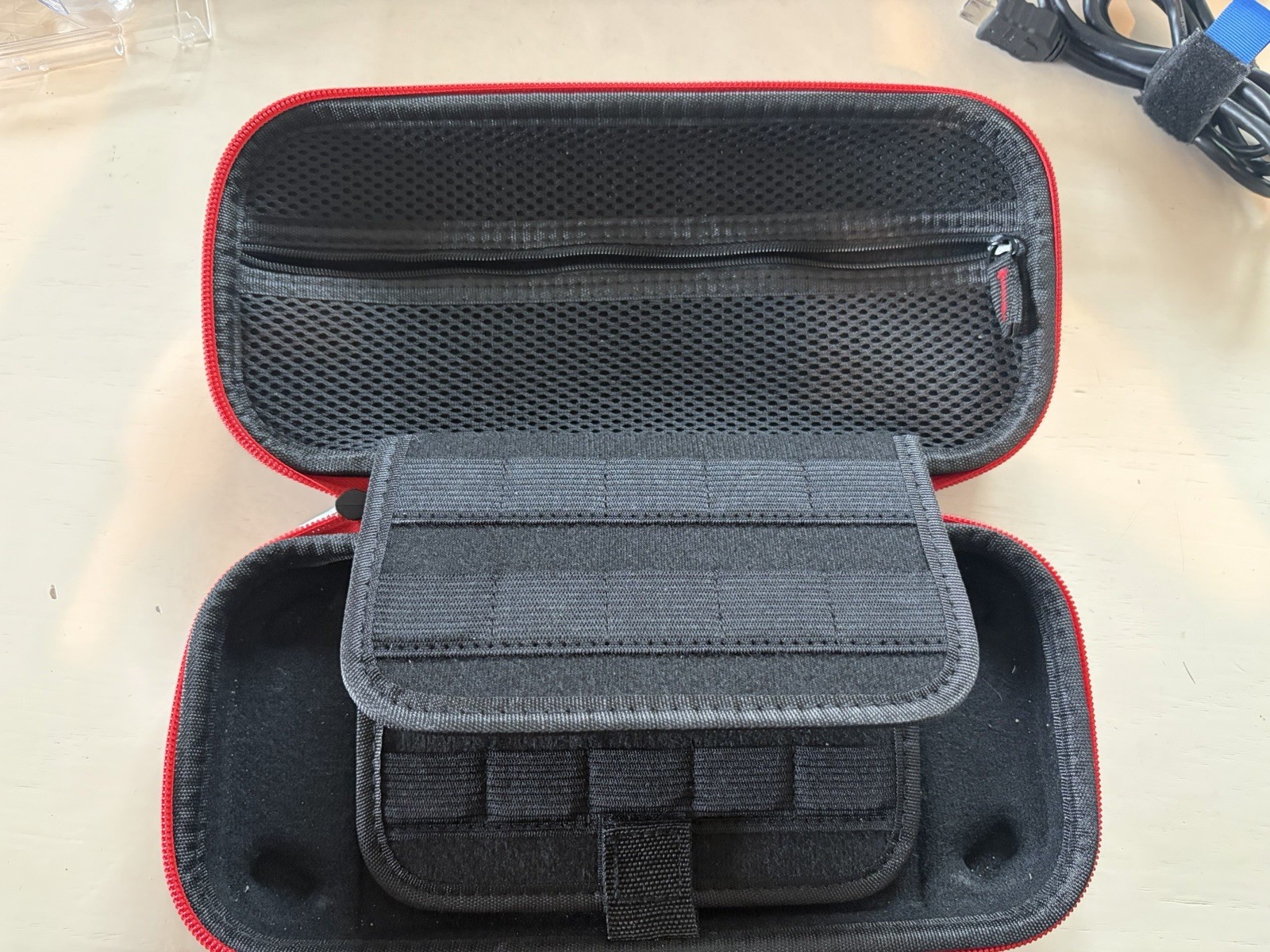 Nintendo Switch version 2, opened box, HAC-001(-01) handheld console, red/blue.