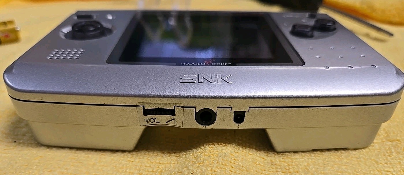 SNK Playmore Neo Geo Pocket Launch Edition Platinum Silver Handheld System.