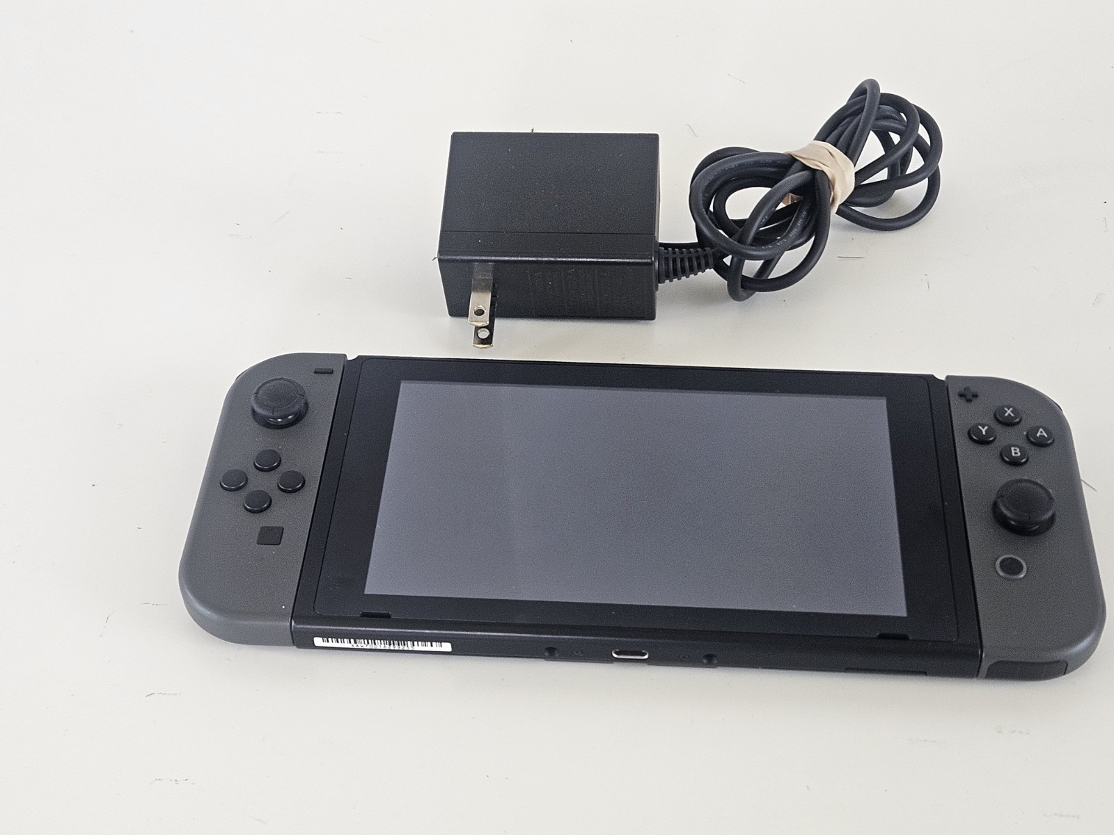 NINTENDO SWITCH HANDHELD – HAC-001 + OEM Charger – Tested