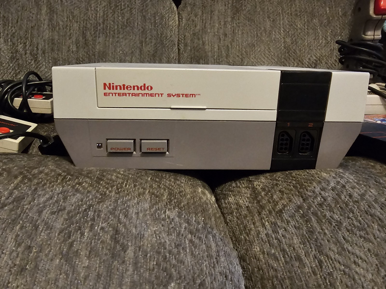 Original NES Console With Controllers, Hookups, Guns, Joysticks And Mega Man 2