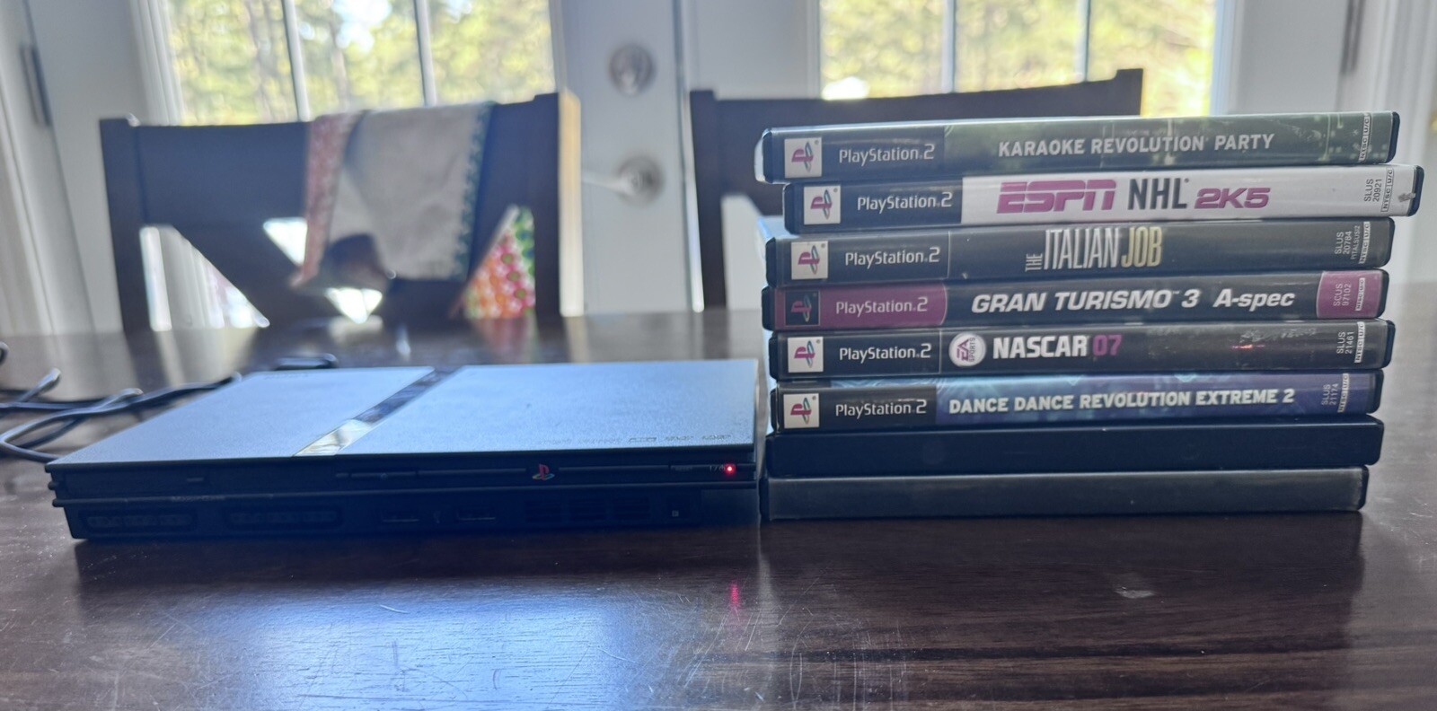 Sony PlayStation 2 Slim Console – Black + 8 Games