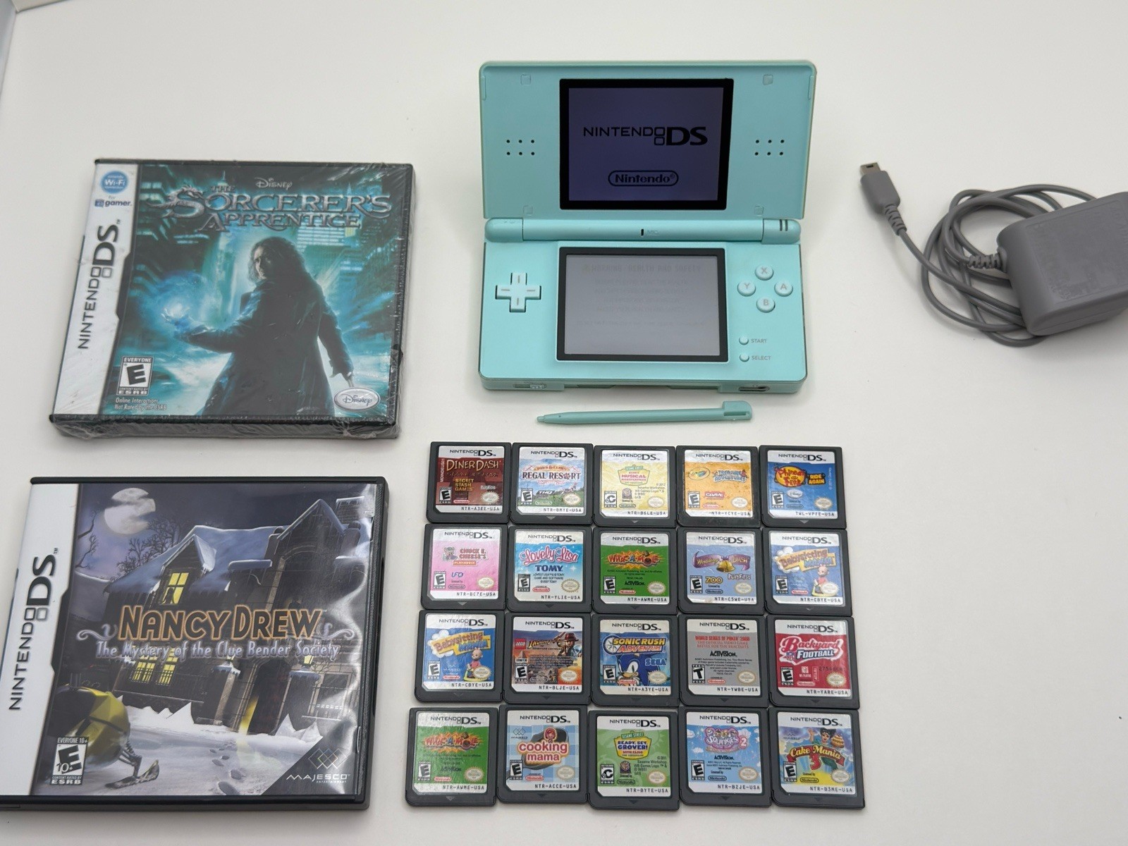 Nintendo DS Lite Ice Blue Bundle 23 Games Charger Stylus CIB & Sealed Game