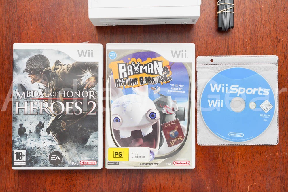 Nintendo Wii White Console Bundle – 2 Remotes, Nunchuk, Sensor Bar & 3 Games