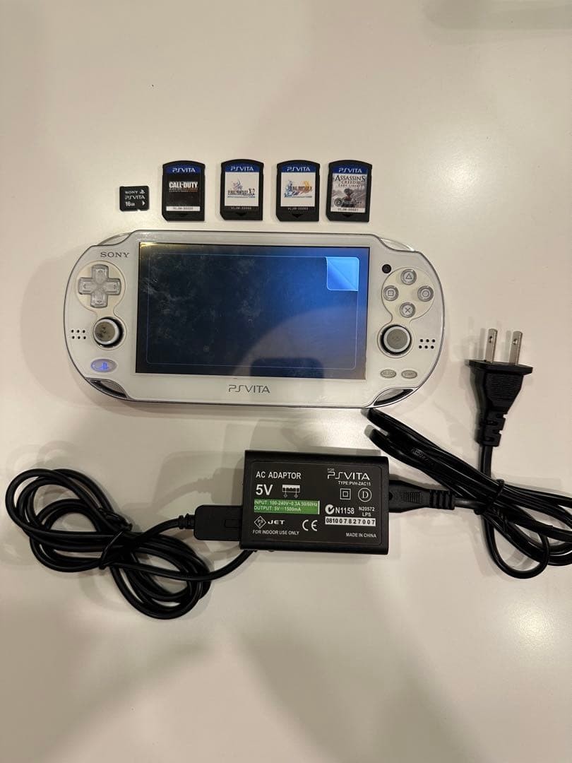 Sony PS Vita PCH-1000 White Console w/ 4 Games Tested Working Region Free