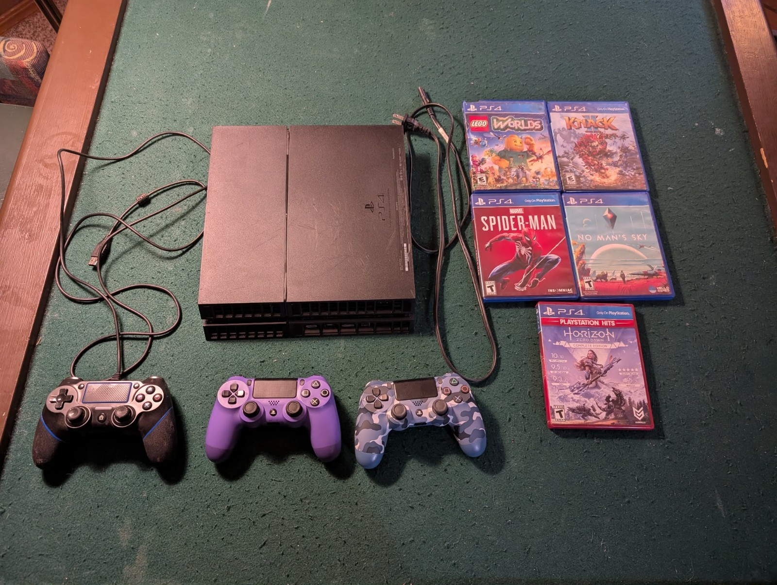 Sony PlayStation 4, game, and controller bundle. 5 games, three controllers.