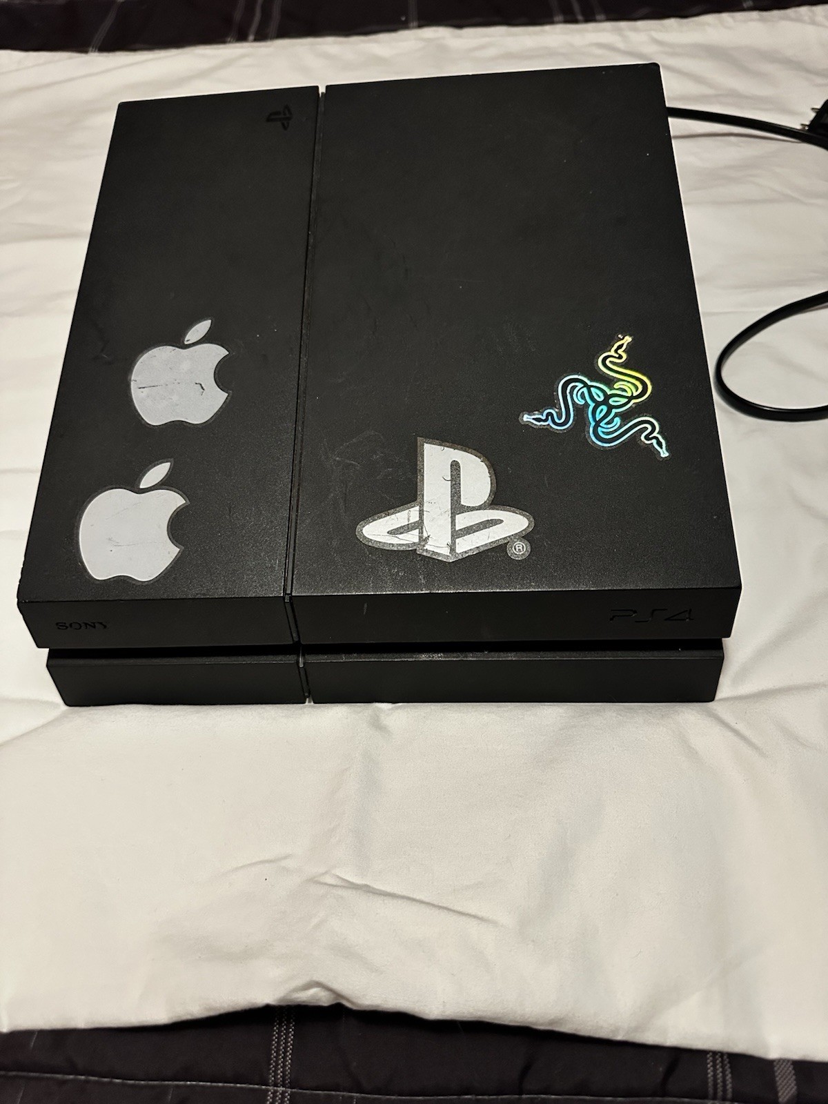 Sony PlayStation 4 (500 GB) Black with controller and head set.
