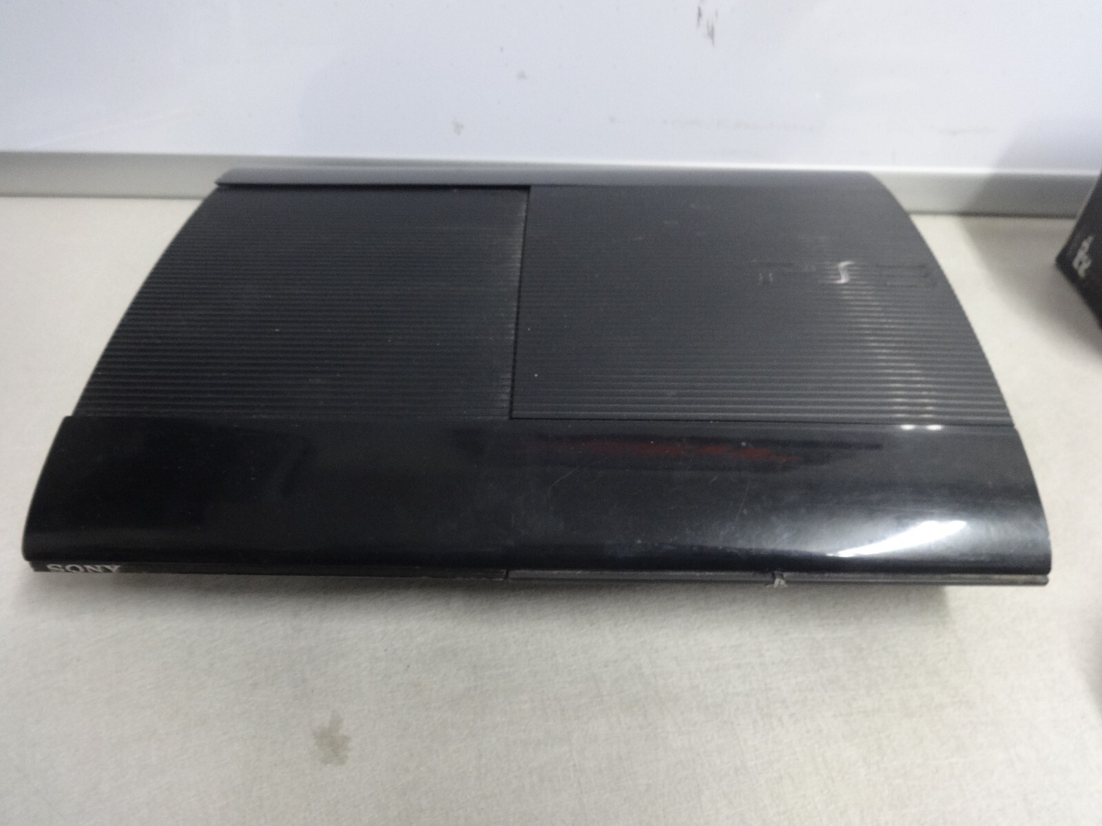 PS3 Super Slim 12GB CONSOLE BUNDLE – Black Plus 2 Controller, & Cords CECH-4301A