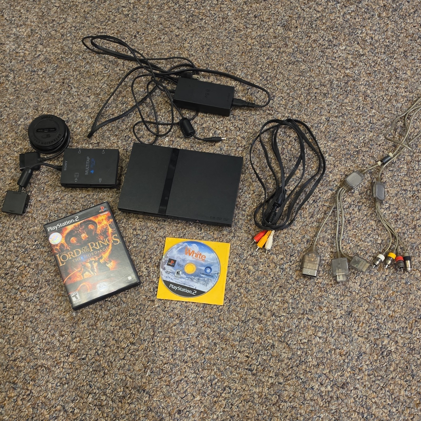 Sony PlayStation 2 Slim console w/ games and accessories.
