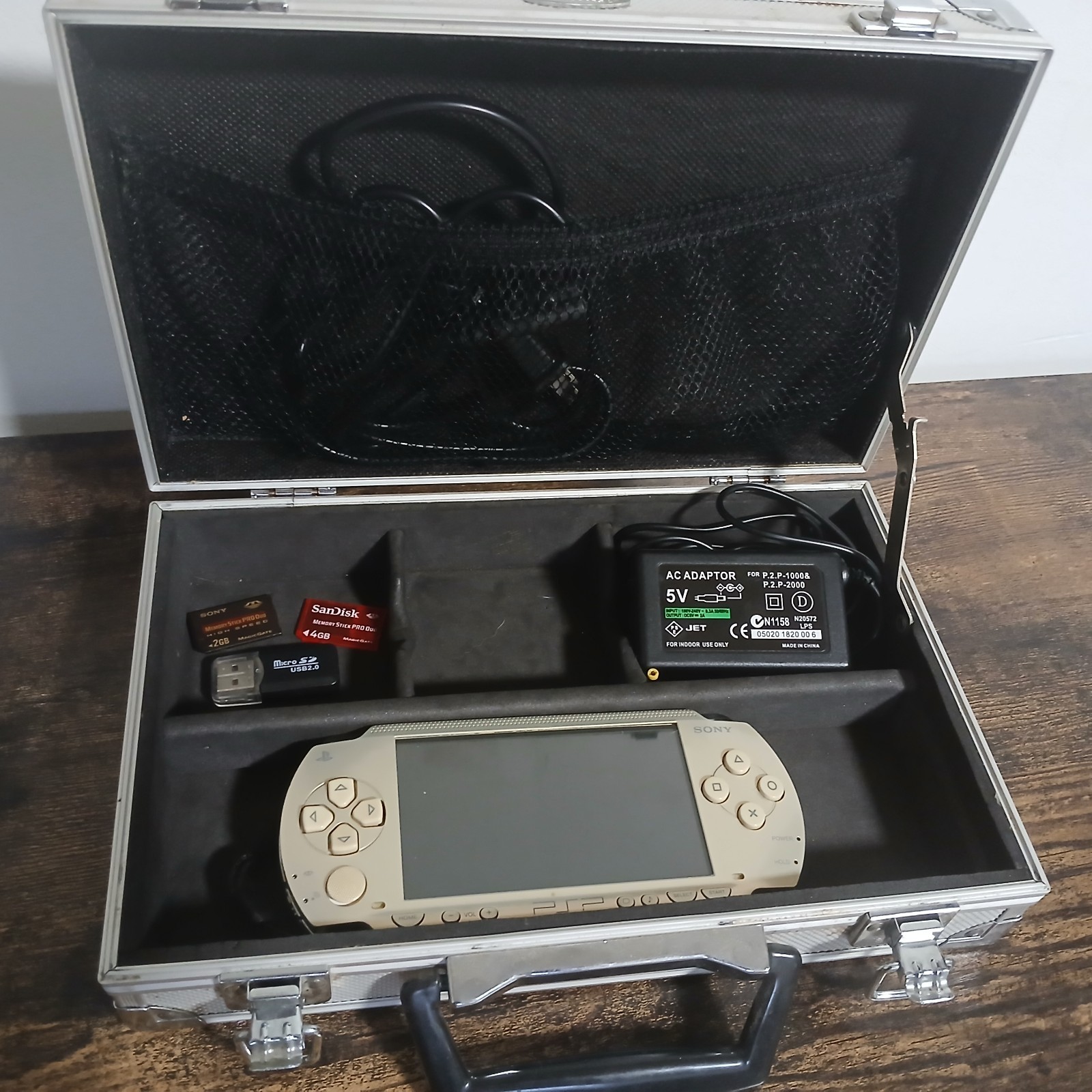 Sony PSP 1000 Gold with AC Adapter Charger Memory Cards Case