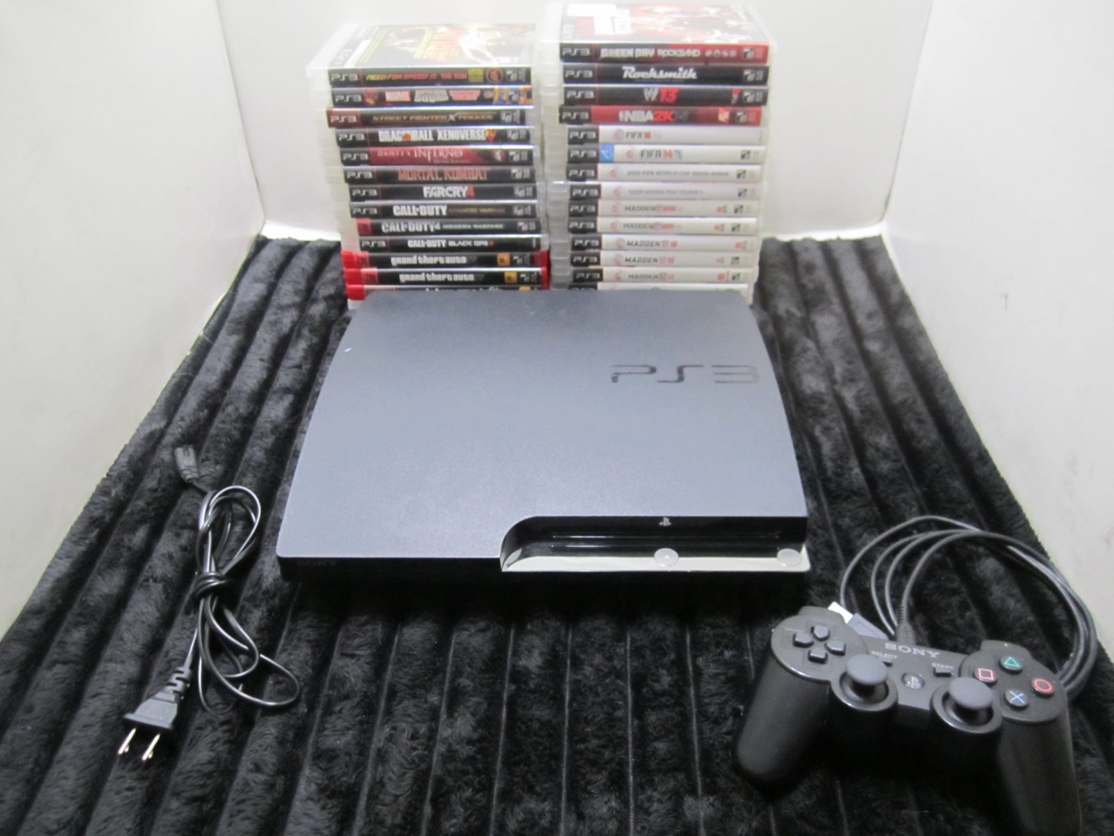 PS3 Lot Including 1 Remote, Power Supply and 29 games