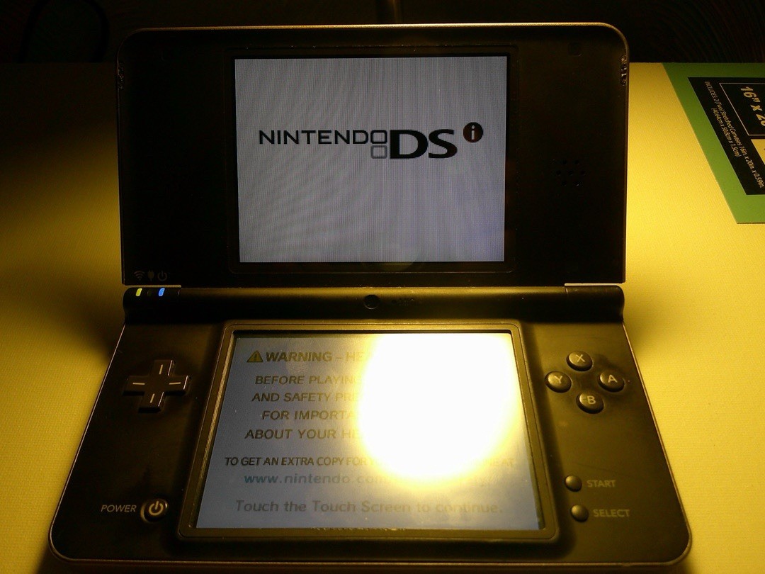 Nintendo DSi XL Black Handheld System for Nintendo DS Wi-Fi Camera Headphone