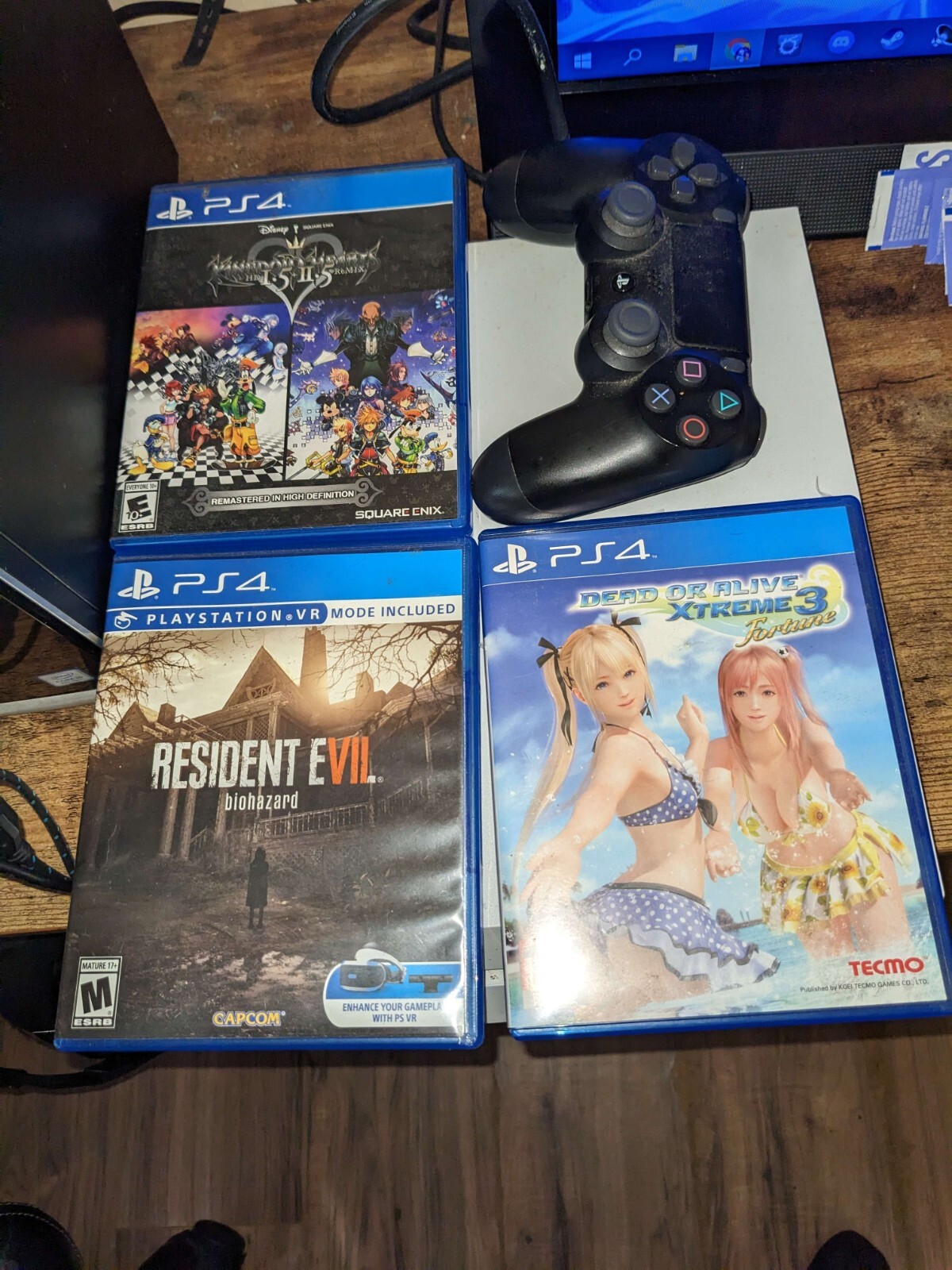 PS4 500GB White with black controller and 3 games(RE7, DoA Ex 3, & KH1.5&2.5 HD)