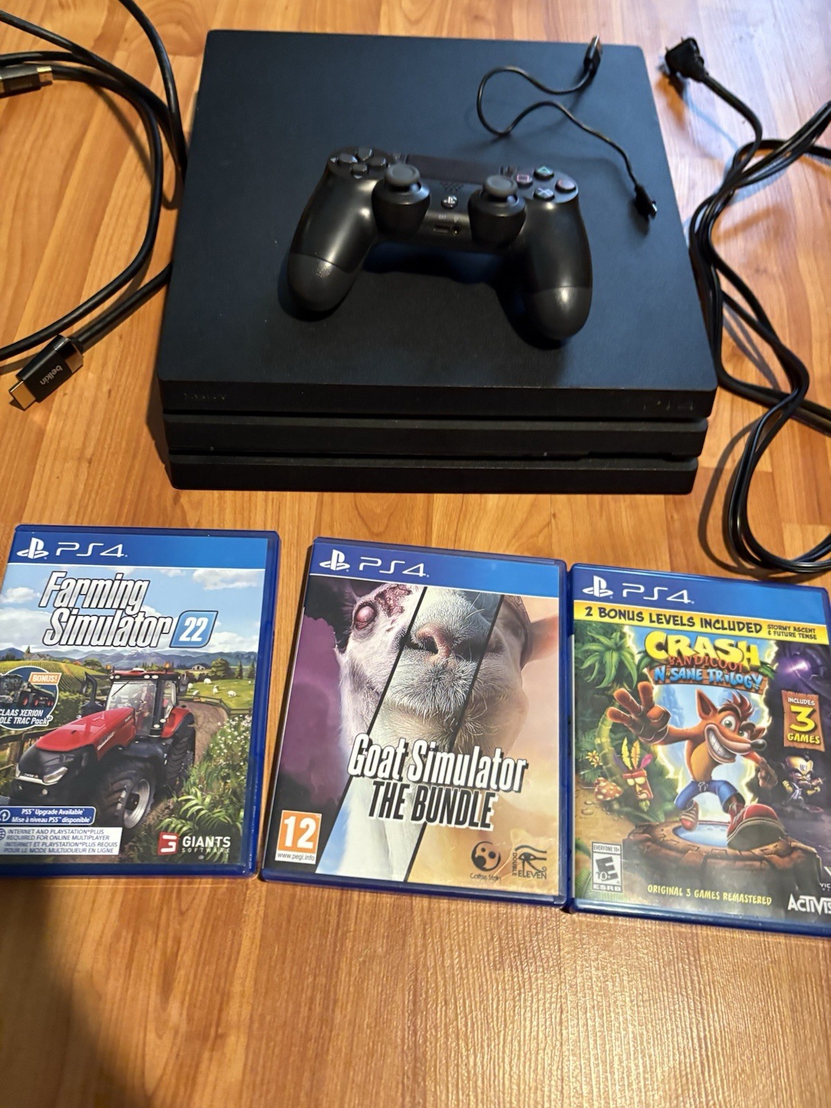 Sony PlayStation 4 Pro 1TB Jet Black with Cords and 3 Games