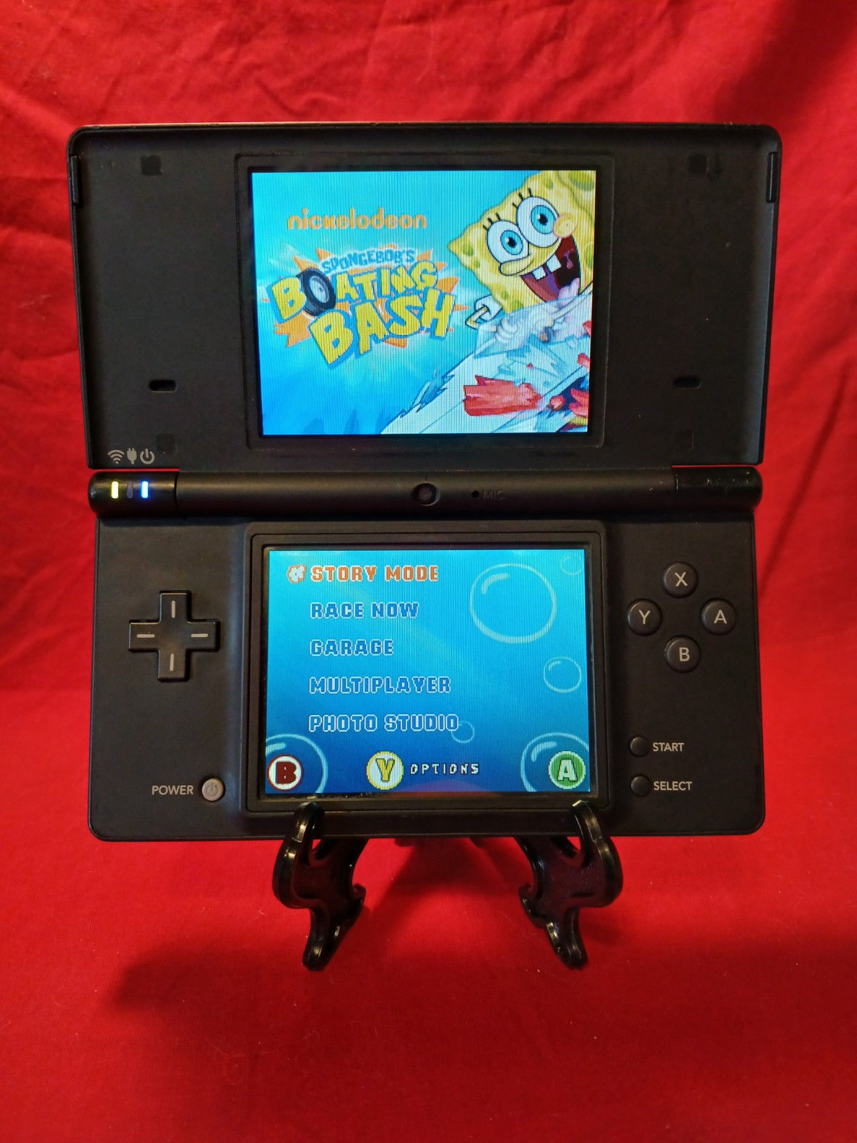 Nintendo DSi Black Handheld System With SpongeBob’s Boating Bash Game