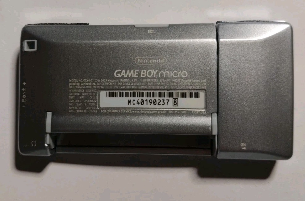 Nintendo Game Boy Micro GBA (Working) with Cracked Faceplate & 3rd-Party Charger