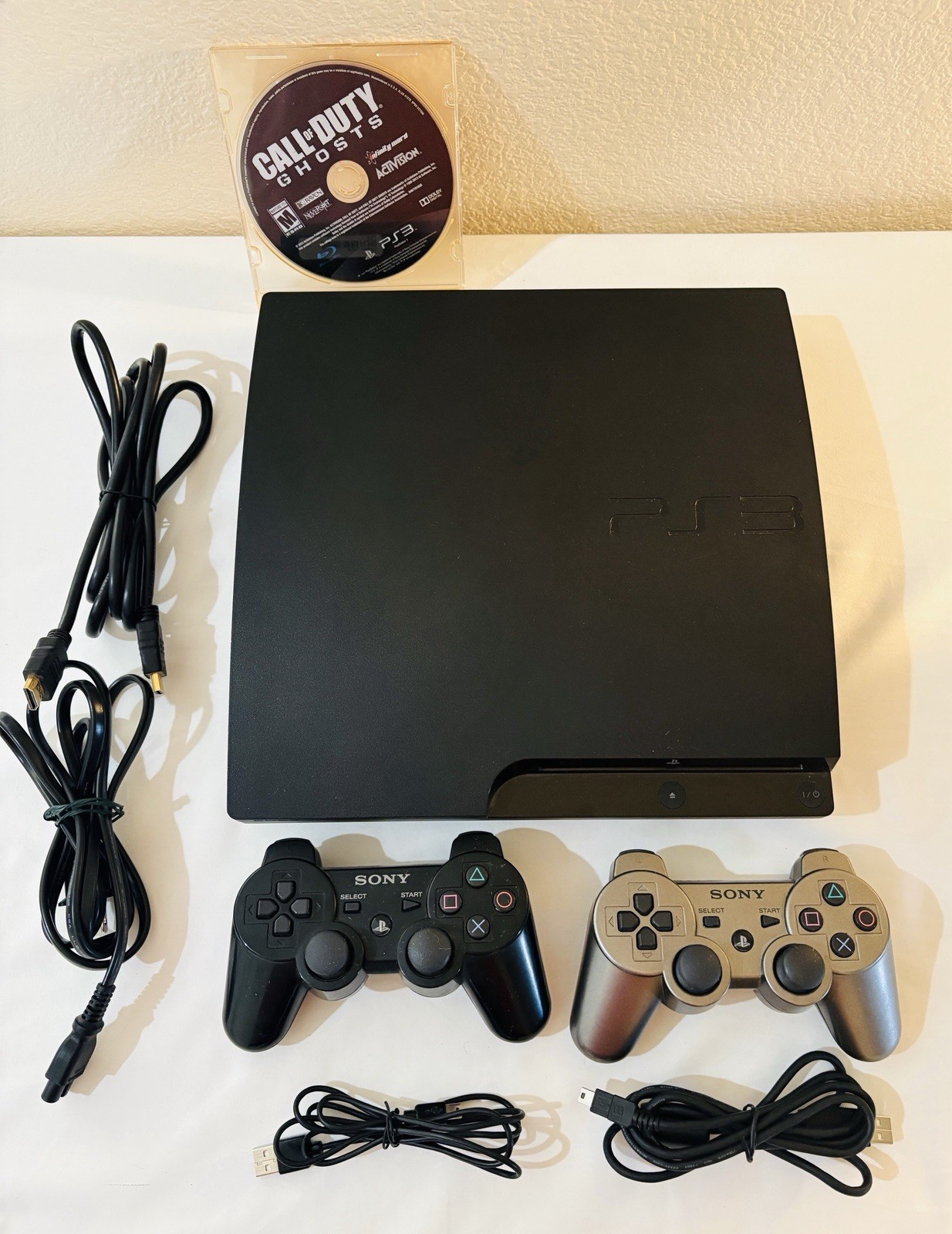 Sony PS3 Slim 320GB CECH-3001B, 2 Genuine Sony DualShock 3 Controllers, Clean