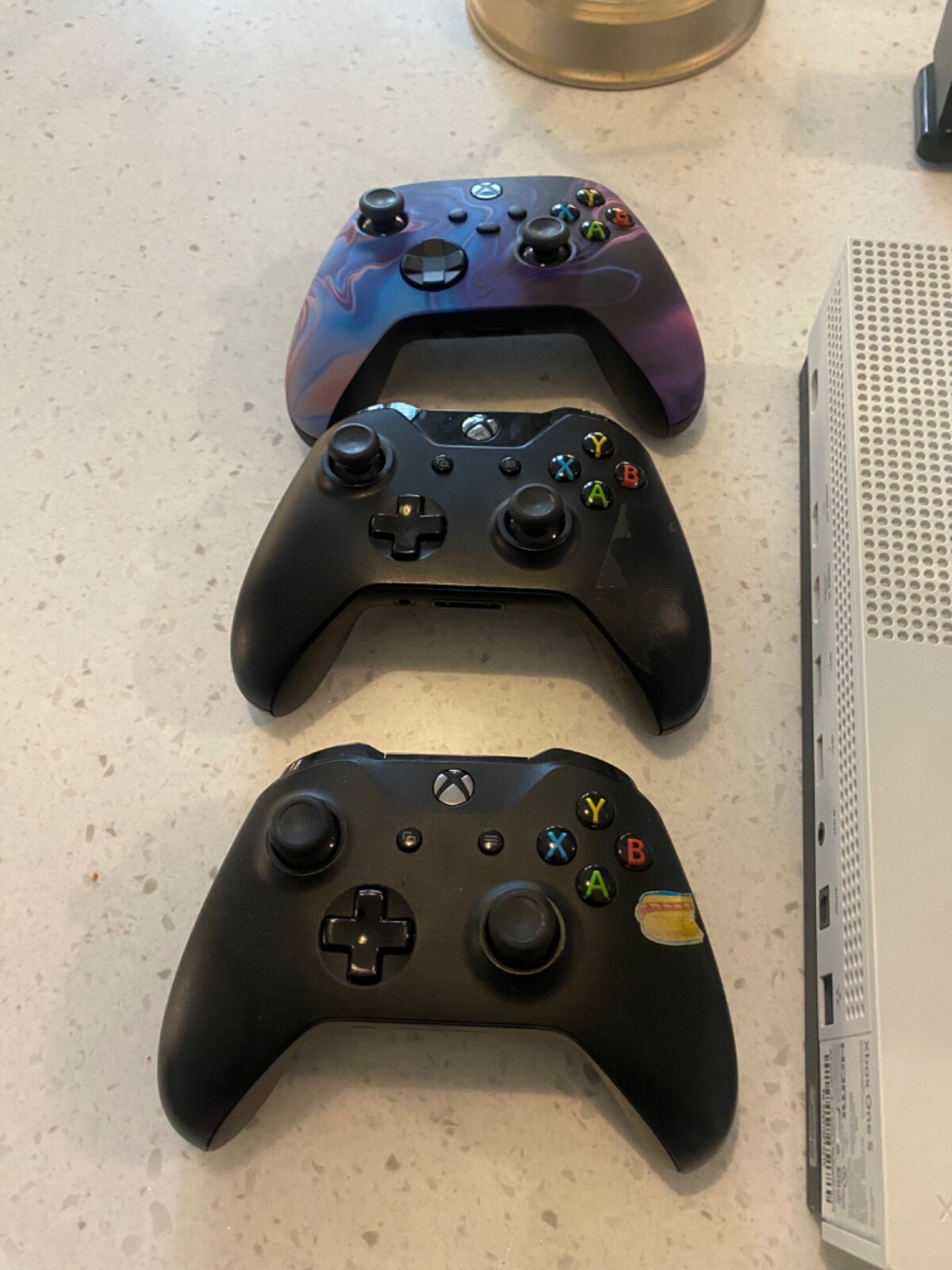 Xbox with custom controller and a Bluetooth headset with wireless charger
