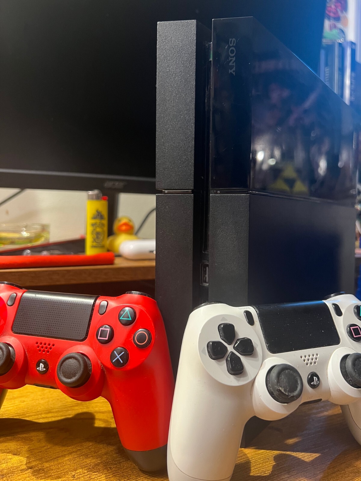 PlayStation 4 (Used) with 3 Controllers (red, white, and blue) and 9 PS4 Games
