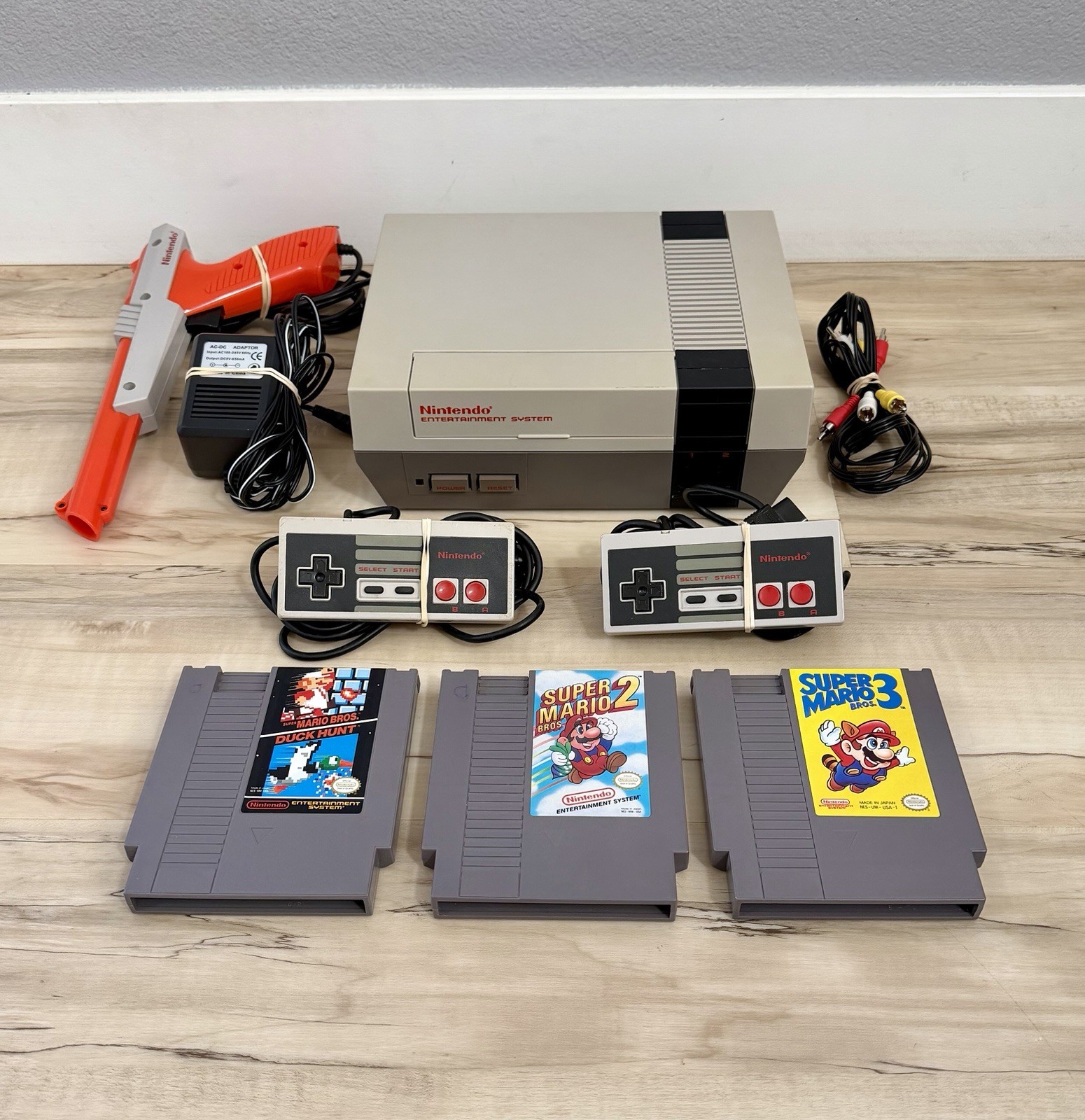 NES Bundle with Super Mario Bros 1,2,3 + Controllers + Zapper Gun – Tested